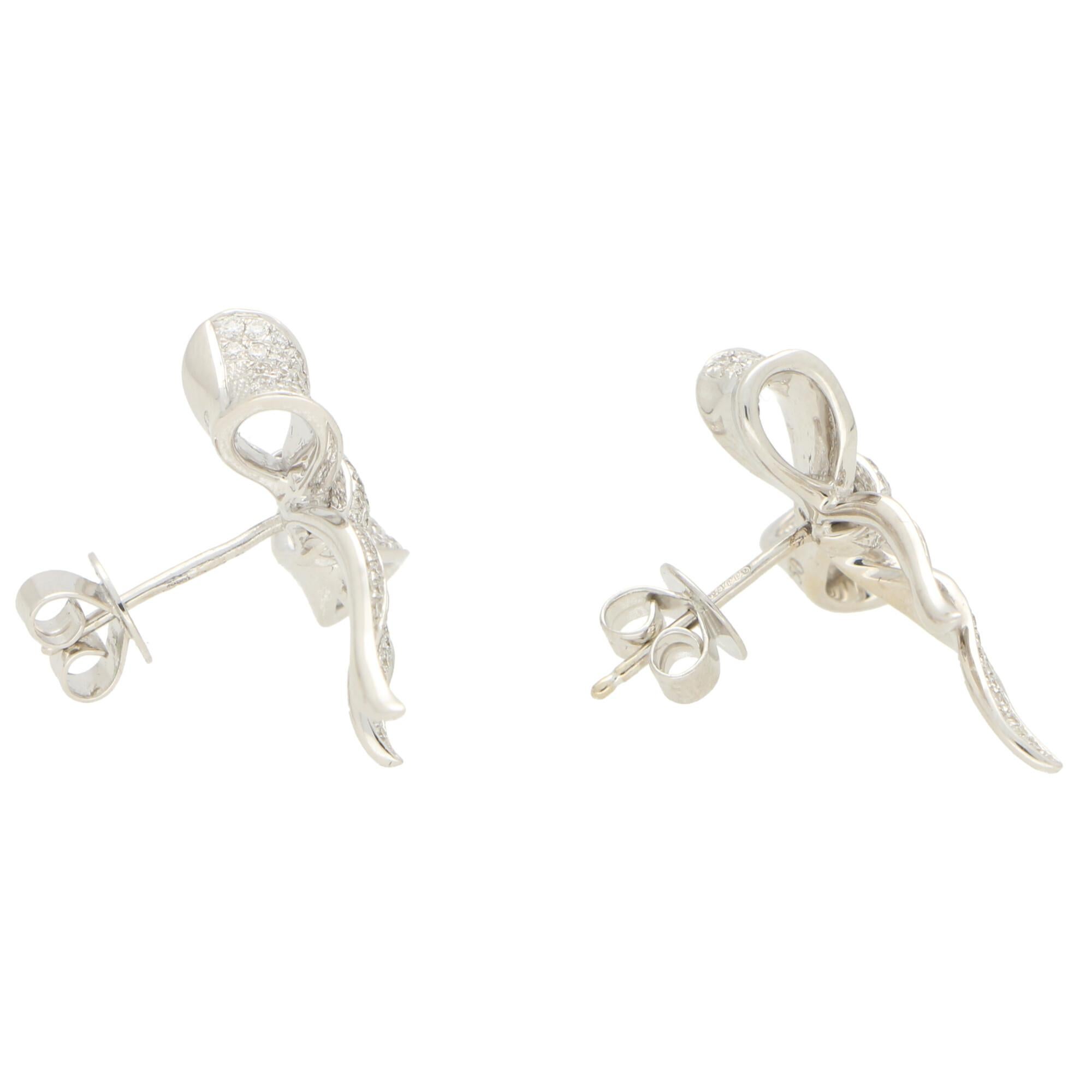 A beautiful pair of pave set diamond bow earrings set in 18k white gold.

Each earring depicts a beautiful bow which is pave set entirely with round brilliant cut diamonds. The earrings have been expertly crafted and the bows look incredibly