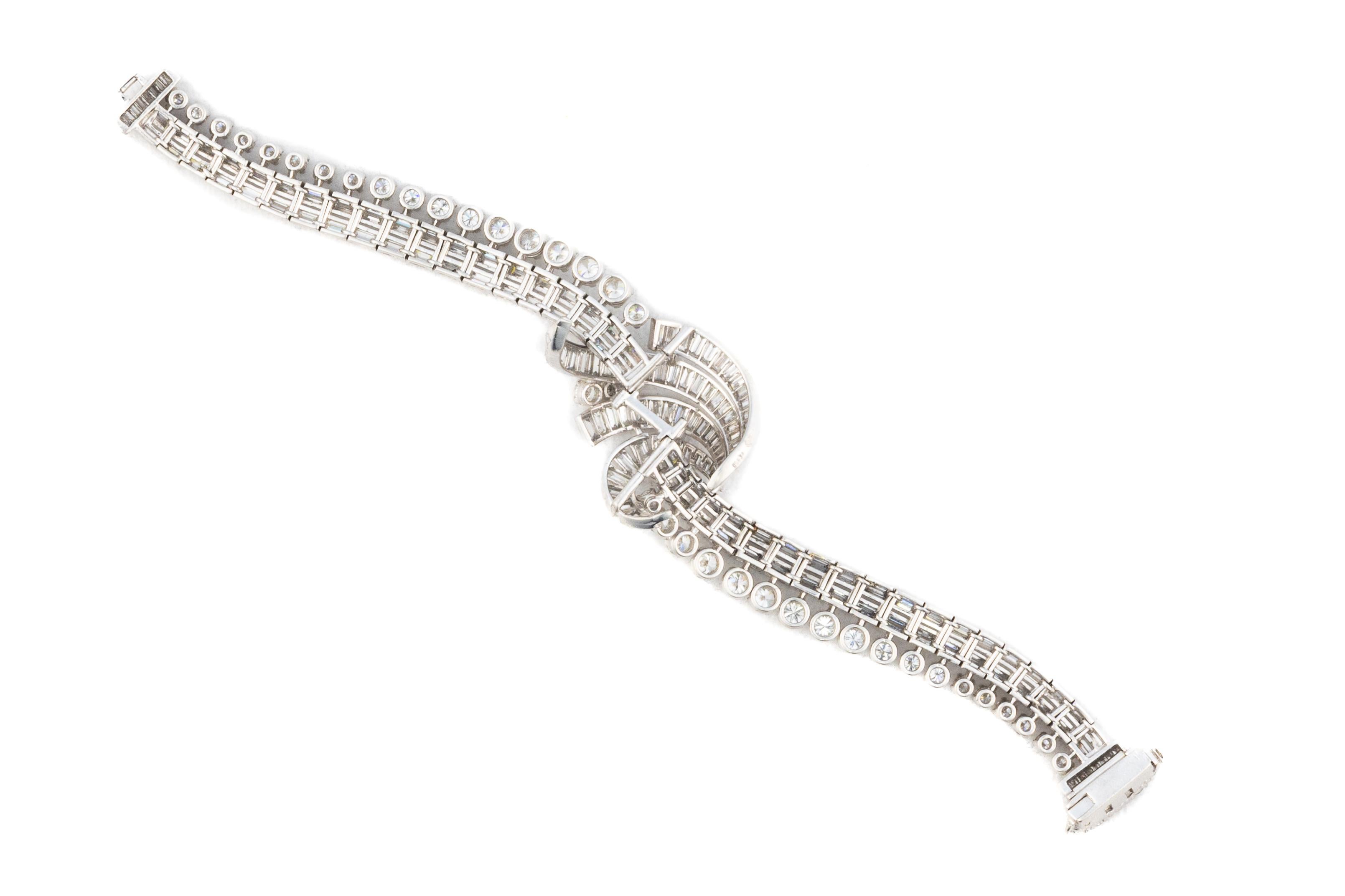 Diamond Ribbon Multi Row Bracelet

Crafted in a graceful ribbon motif, this mid-century bracelet is a study in fluid elegance and refined craftsmanship. Set in platinum, the design features alternating rows of round brilliant and baguette-cut