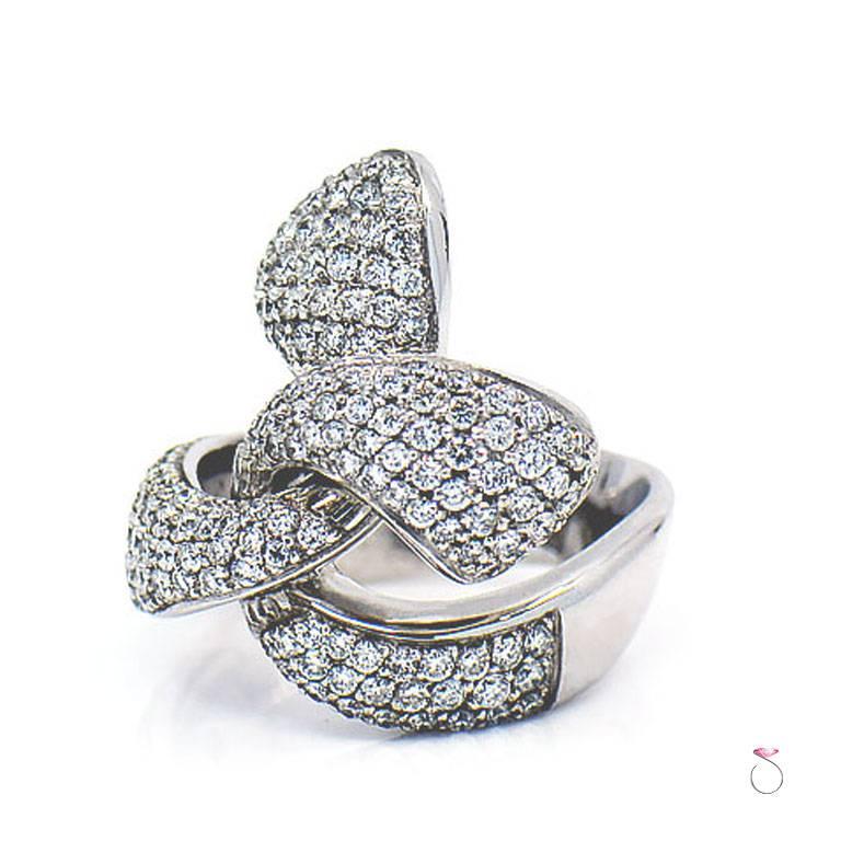 Beautiful diamond cocktail ring in 18K white gold by Assor Gioielli. This magnificently crafted ring features a totalof 2.47 ct. round brilliant diamonds. All diamonds are Pave' set in a stunning ribbon design that flows very elegantly. The ring is