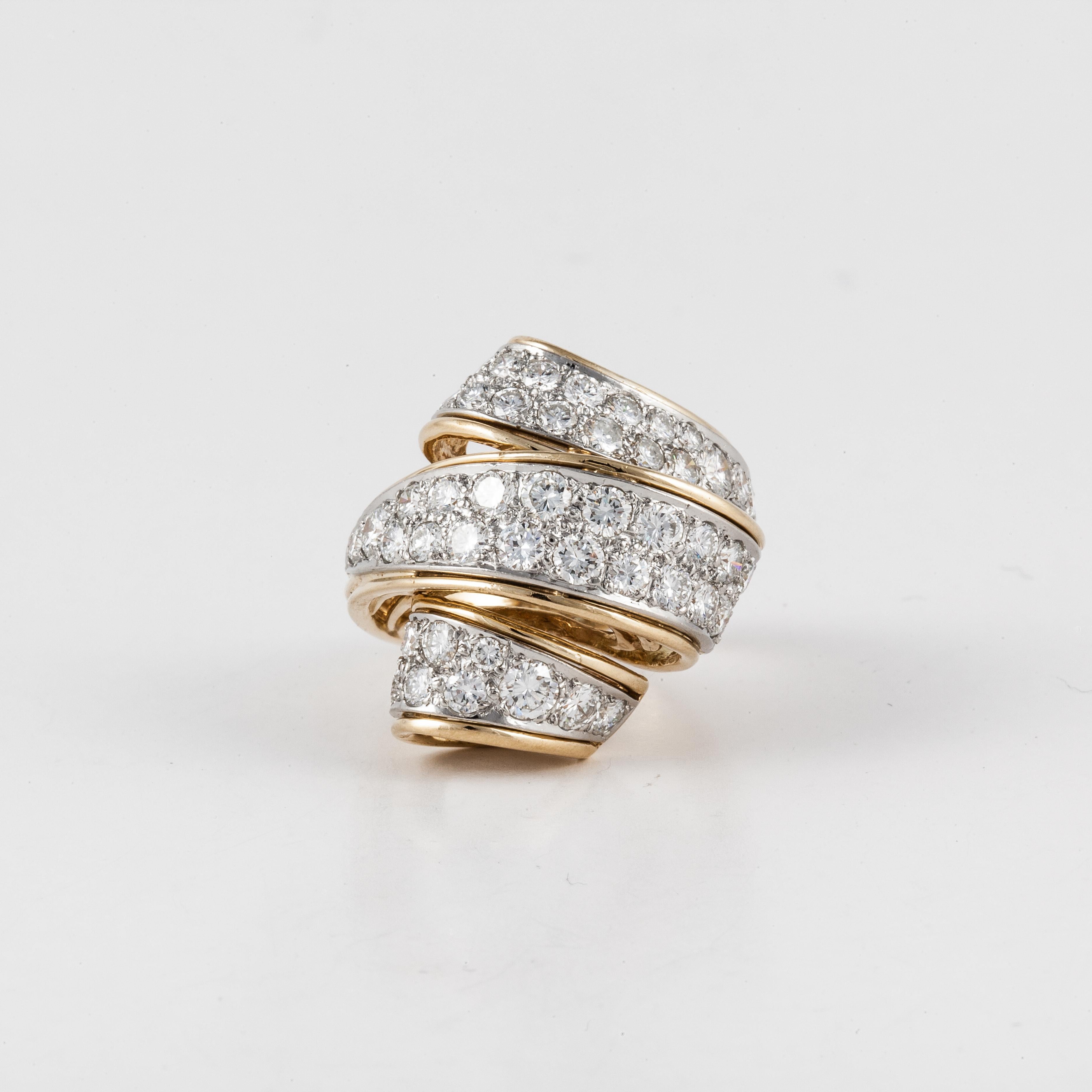 Ribbon style ring composed of 18K yellow gold with round brilliant-cut diamonds.  There are 51 round diamonds that total 3.75 carats; F-H color and VVS2-VS2 clarity.  The ring is a size 7.  The presentation area is 7/8 inches long by 7/8 inches wide