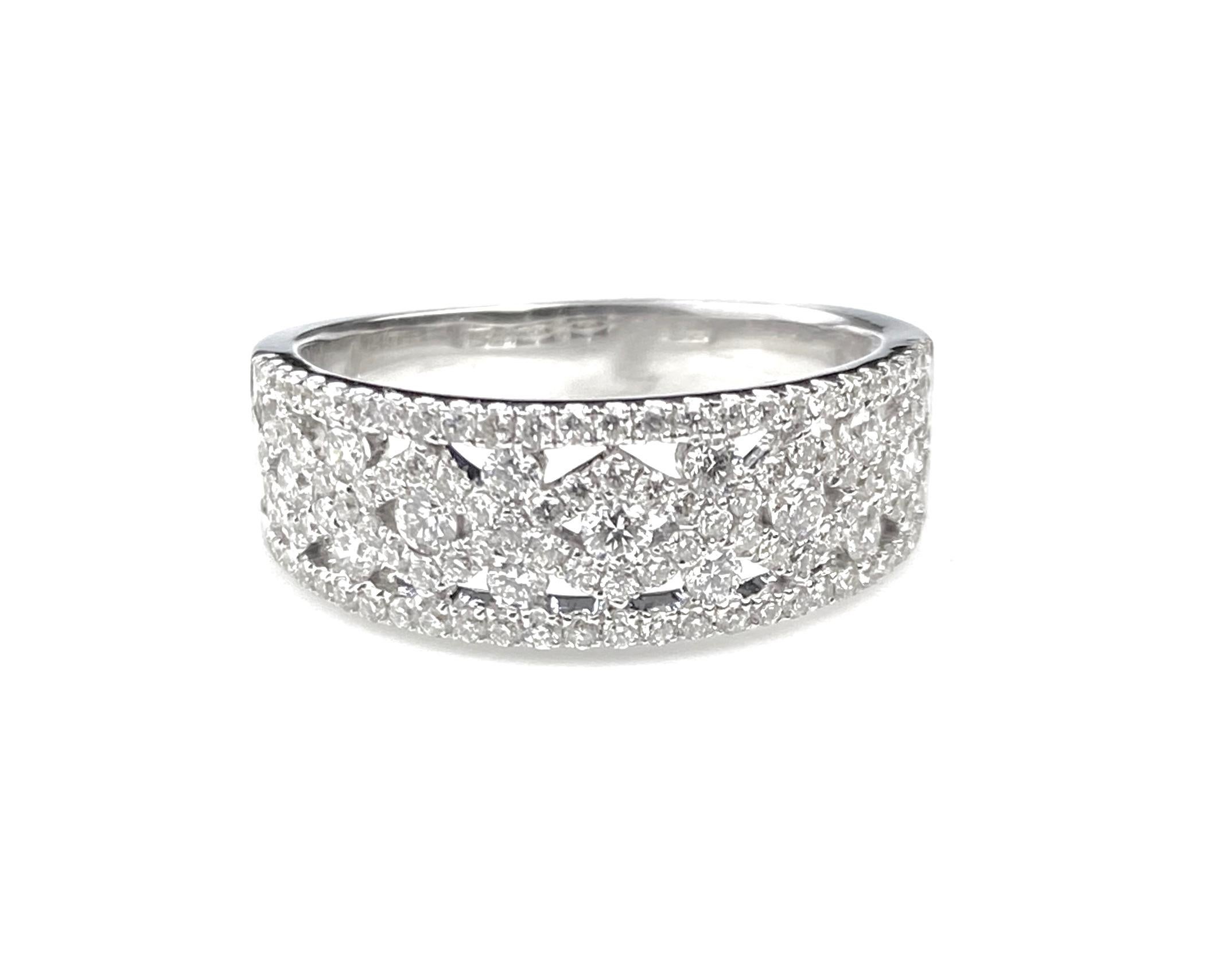 Ladies' right hand diamond ring with patterned design. Set half way around with 0.85ct total diamonds in 18kt white gold. Ring size 6 1/2. Complementary ring resizing up or down one ring size.