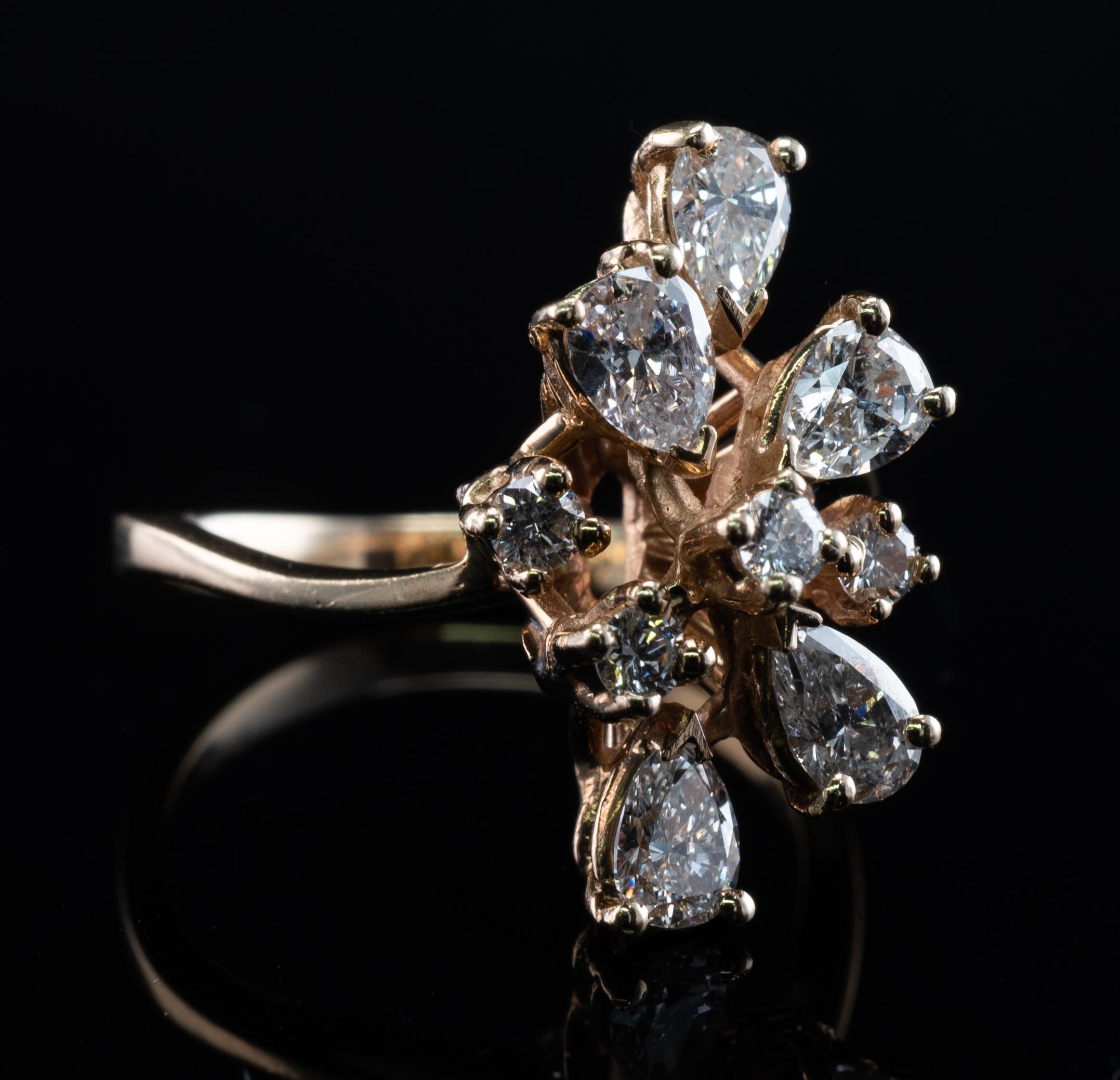 This estate ring is made in solid 14K Yellow Gold.
It is set with 5 pear cut and 4 round diamonds.
The pear cut diamonds total 1.25 carat and round diamonds are .28ct.
The total diamond weight for the ring is 1.53 carat.
The diamonds range from