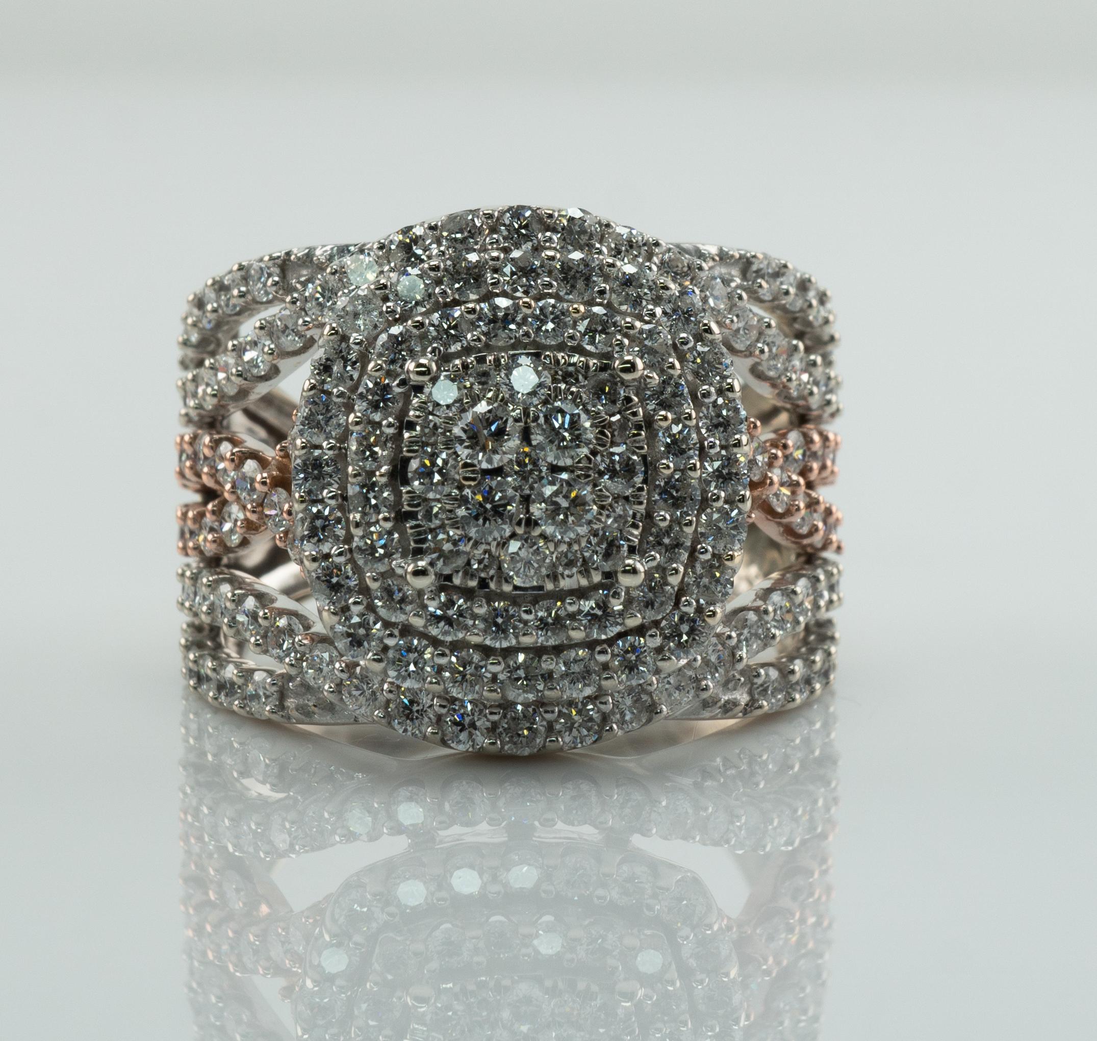 Diamond Ring 14K White and Rose Gold 2.60 TDW Cluster Cocktail

This estate ring is crafted in solid 14K White Gold and Rose gold for accents (carefully tested and guaranteed).
The ring is set with 146 natural round cut diamonds totaling 2.60