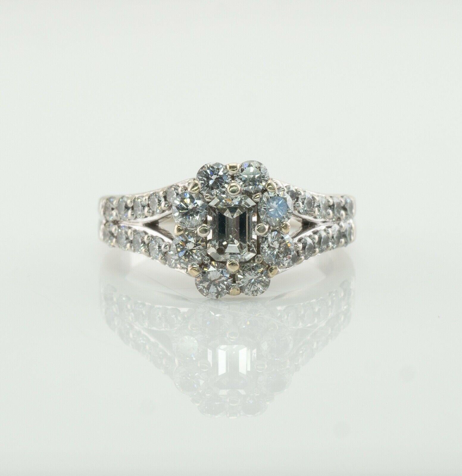 This stunning estate engagement ring is finely crated in solid 14K White gold and set with natural diamonds. The center gem is .20 carat, it is VS1 clarity and H color gem. It is surrounded with 8 round brilliant cut diamonds (total .56 carat) and