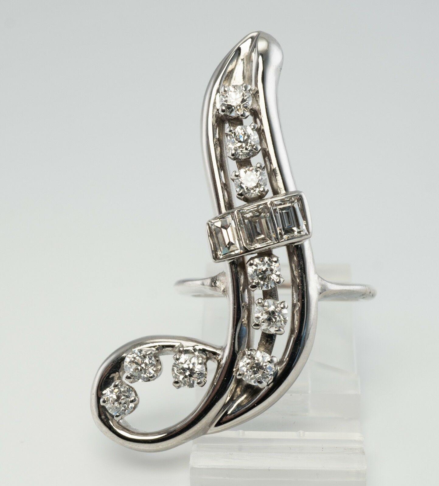 This very unique and one of a kind vintage ring is finely crafted in solid 14K White Gold (carefully tested and guaranteed) and set with white and fiery diamonds. 
There are nine round brilliant cut diamonds total .90 carat and three rectangular