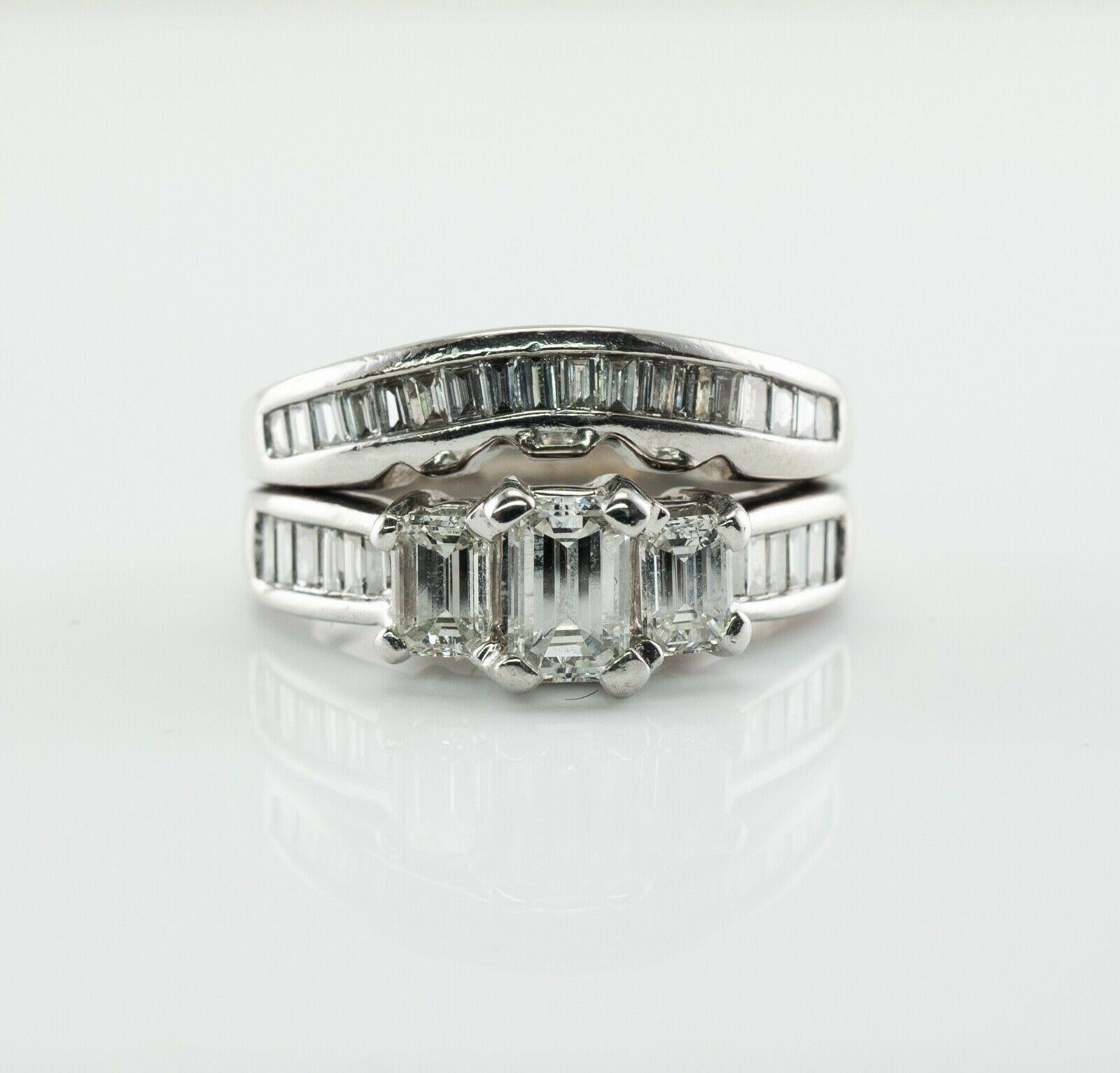 This gorgeous estate ring is finely crafted in solid 14K White gold and set with white and fiery diamonds. Two bands are soldered together. The upper band has three emerald cut diamonds, .25 carat for the center gem and .16 carats for two side gems.