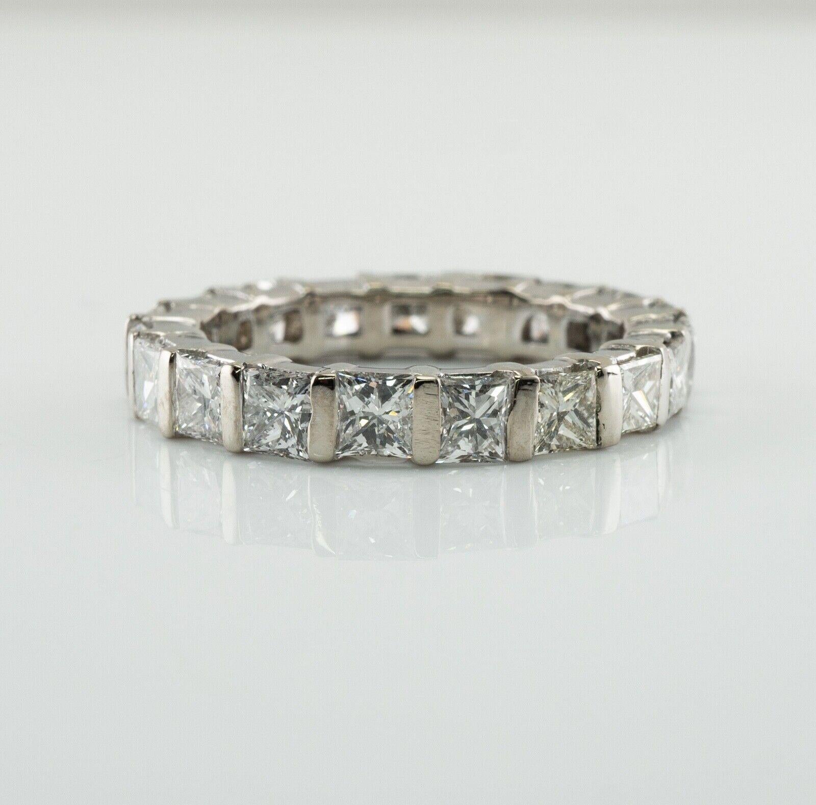 Natural Diamond Ring Geometric 18K White Gold 3.32 TDW

This beautiful estate diamond eternity ring is finely crafted in solid 14K White Gold (carefully tested and guaranteed) and set with nineteen square-cut diamonds. All diamonds go around, no