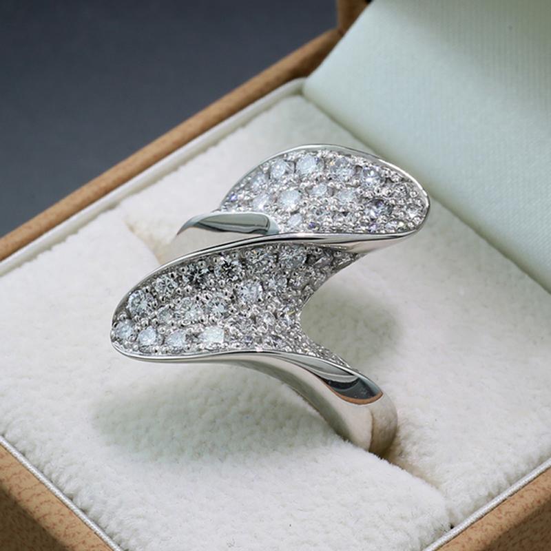 Exceptional Diamond Ring, pavé-set with numerous natural brilliant-cut diamonds approx.  1.76 carats in total, Color: Top Wesselton, Clarity: VS The ring is designed as a stylized lightning bolt with rounded edges. Crafted in solid