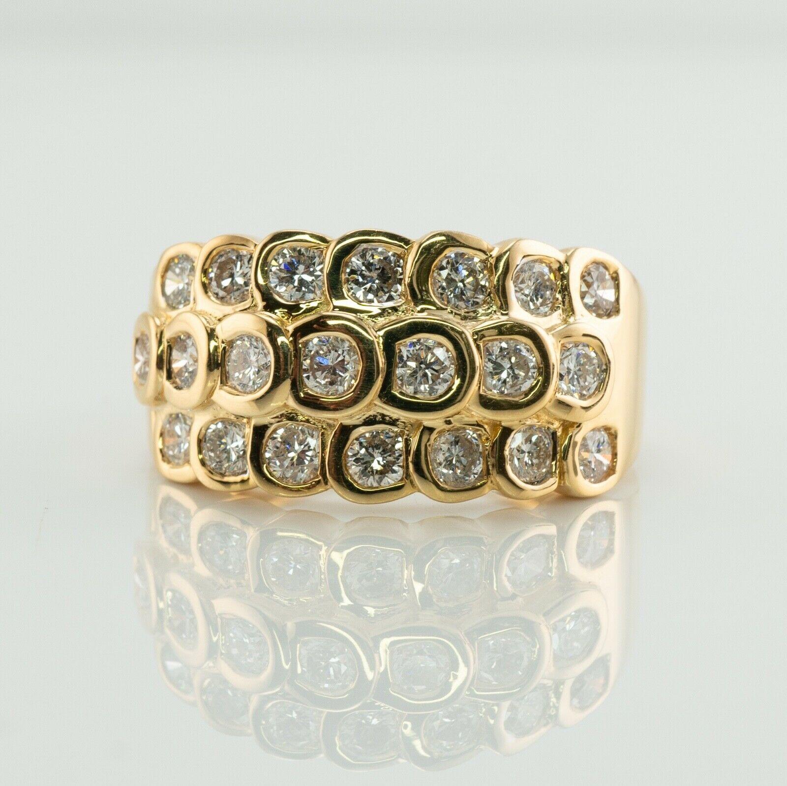 This estate ring is finely crafted in solid 18K Yellow Gold and set with genuine white and fiery diamonds. 
21 round brilliant cut diamonds totaling 1.47 carats of VS2 clarity and H color. 
The top of the ring measures 10mm North-South.
Size 6.5