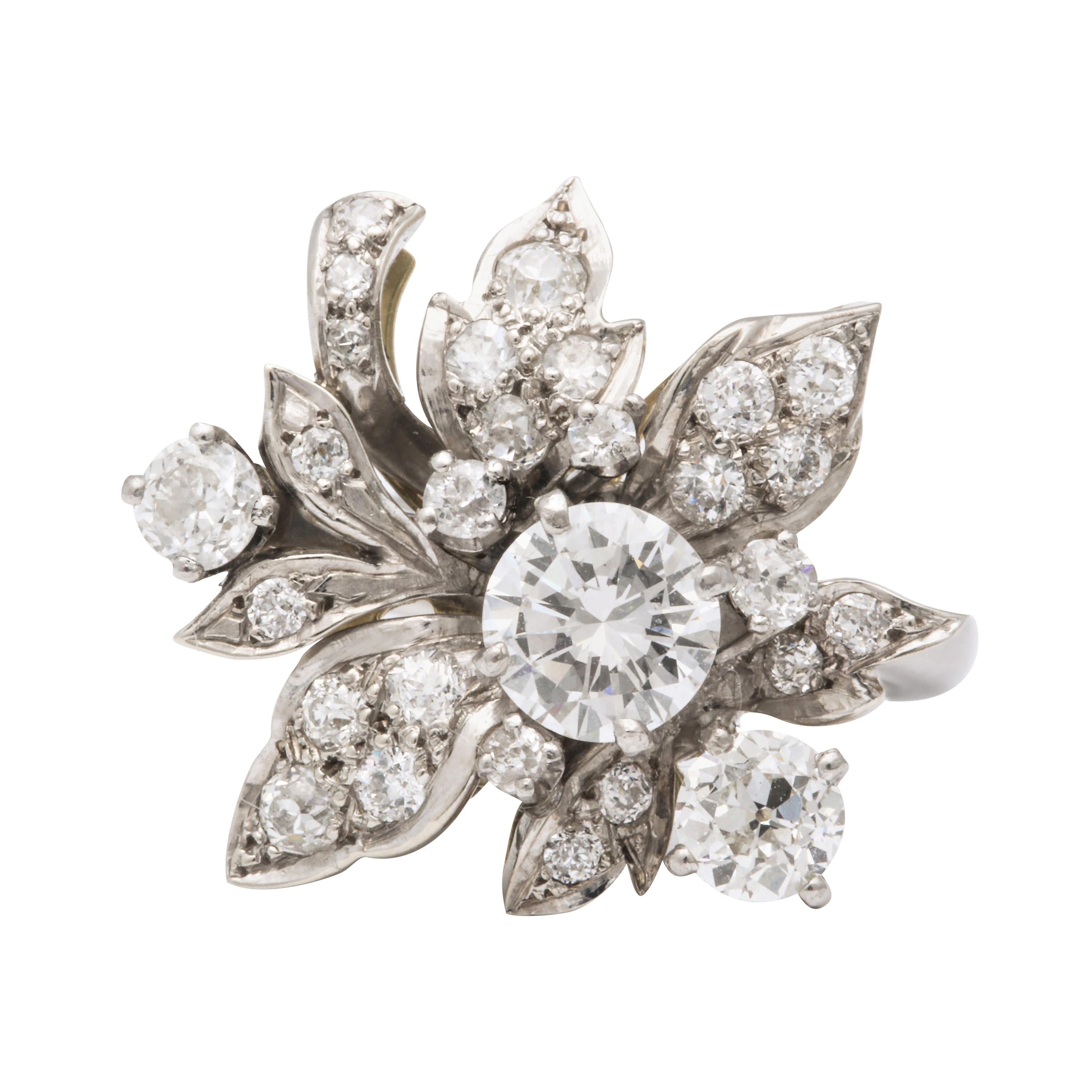 A beautiful  articulated floral grouping of diamonds with a center stone approximately .95 cts along with a variety of  sizes forming petals  and leaves.
This is an amazingly lovely ring that can be worn all the time.
The total of diamonds is 3.5