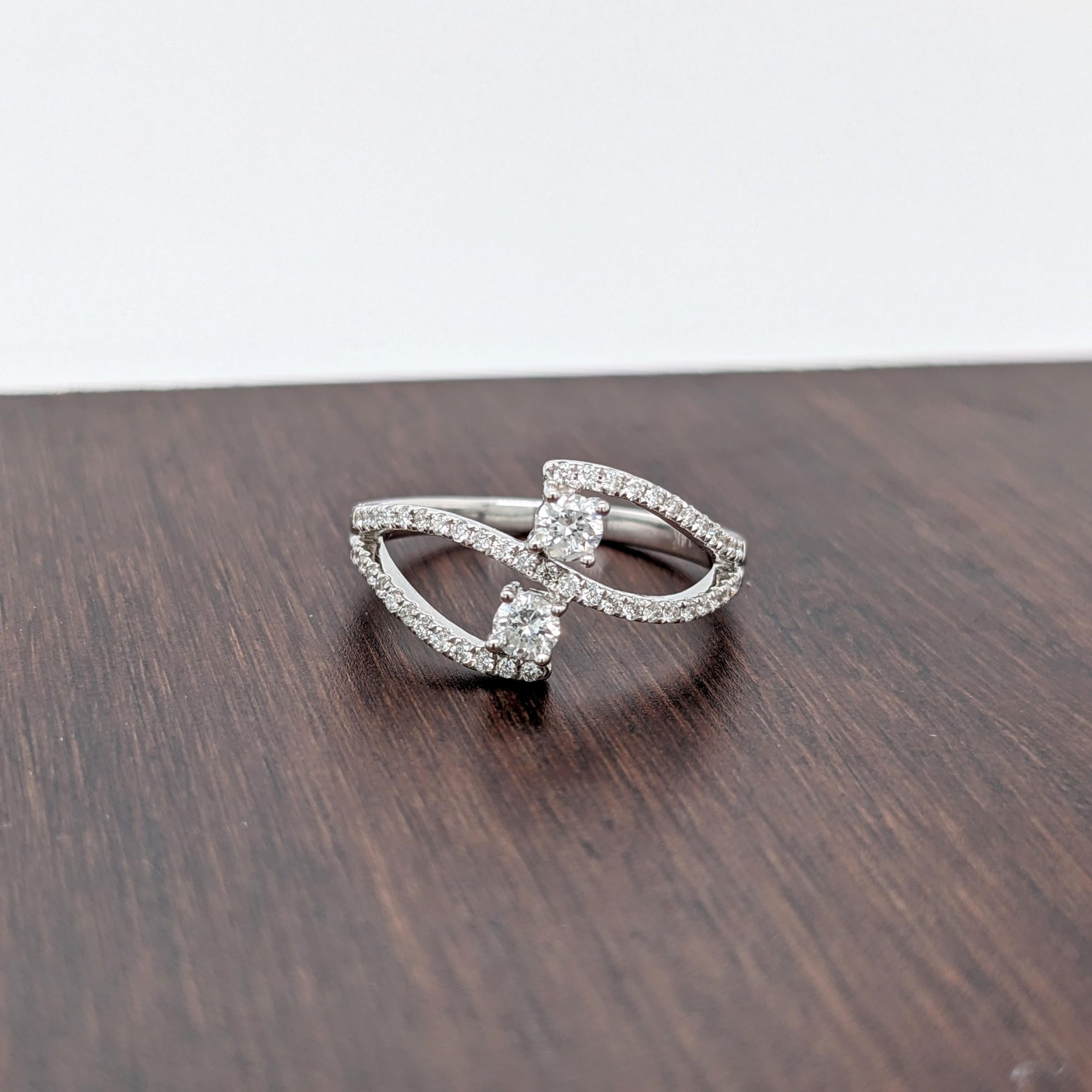 A gorgeous diamond ring made in a unique bypass design with all natural diamond accents in 14k solid white gold.

The occasions to show off this ring are endless - mother's day, graduation, wedding, birthday, date night, Christmas, etc.