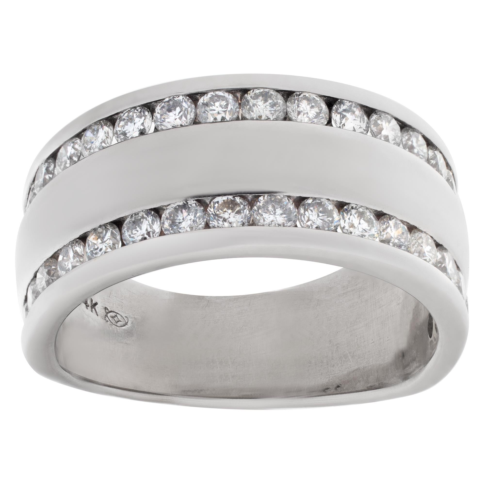 Diamond ring in 14k white gold with double row of channel set diamond accents; approximately 0.75 carats in estimated G-H color, VS clarity. Size 6.5

This Diamond ring is currently size 6.5 and some items can be sized up or down, please ask! It