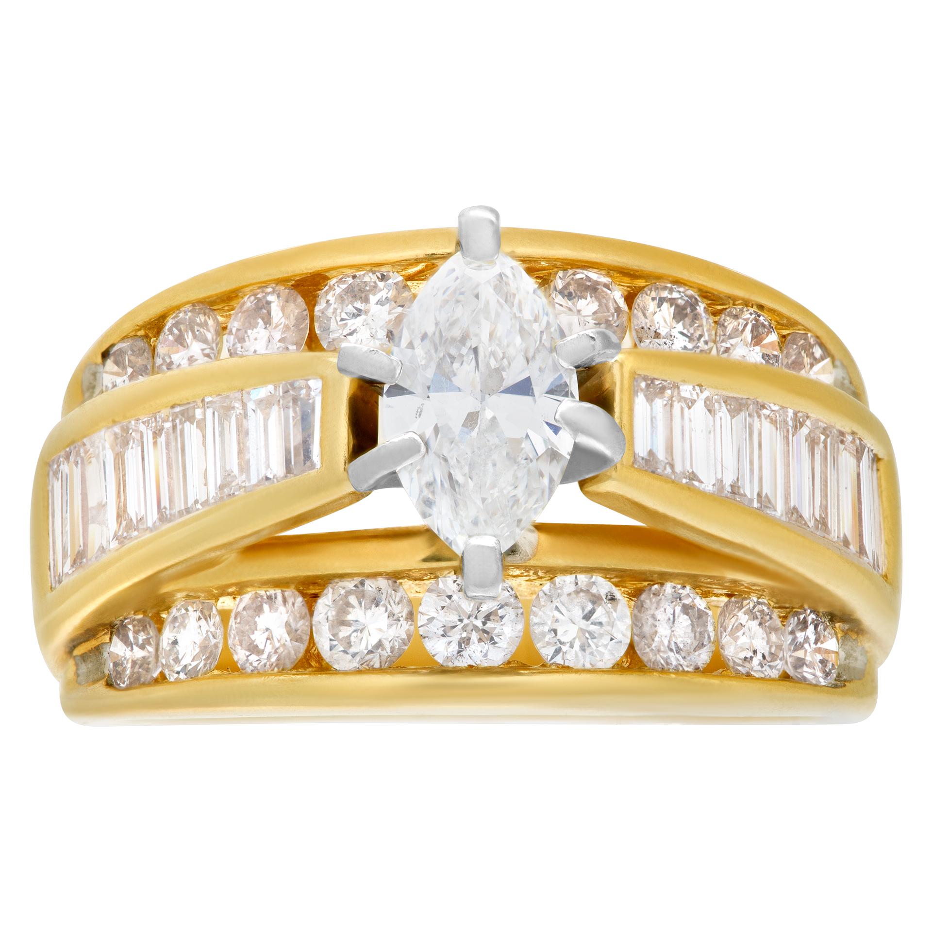 Sparkling marquise cut diamond ring in 14k, with approximately 0.50 carat G-H color, VS clarity center marquise and approximately 1.50 carats in round and baguette diamonds G-H color, VS clarity. Size 5.75  This Diamond ring is currently size 5.75