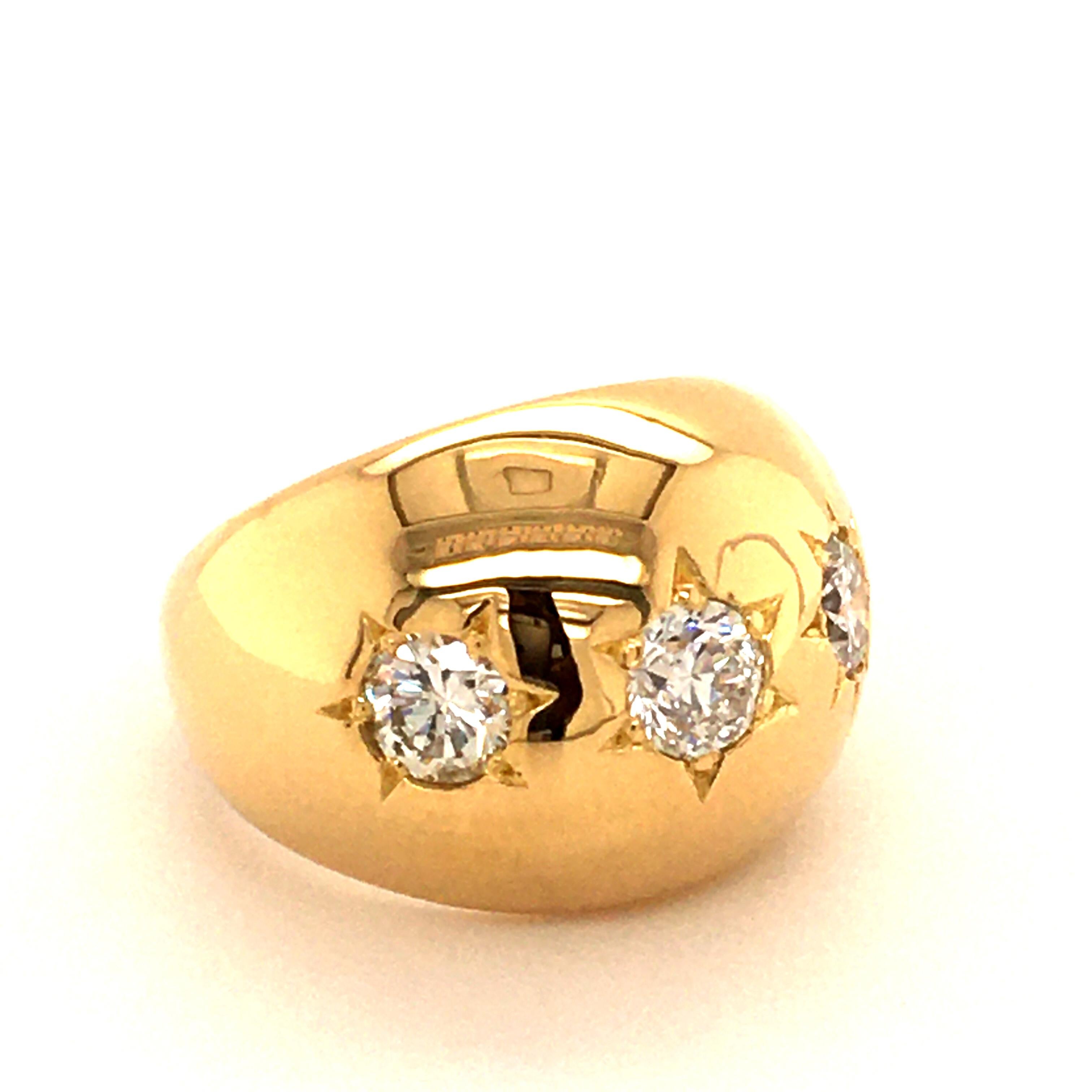 This beautifully shaped ring in 18 karat yellow gold is set with an Old European cut diamond of 0.35 carats, G/H colour and si clarity. The charming center stone is flanked by two brilliant cut diamonds of G/H colour and si clarity, total weight