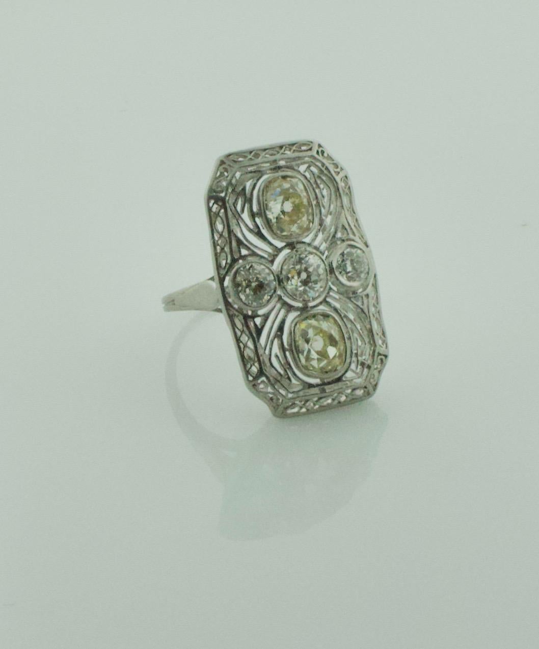 Circa 1920's Diamond Ring in Platinum
Two Old Mine Cut Diamonds weighing 1.10 carats approximately [KL - SI] [bright with no imperfections visible to the naked eye]
Three Old Mine Cut Diamonds weighing .60 carats approximately [GH VS- SI] [bright