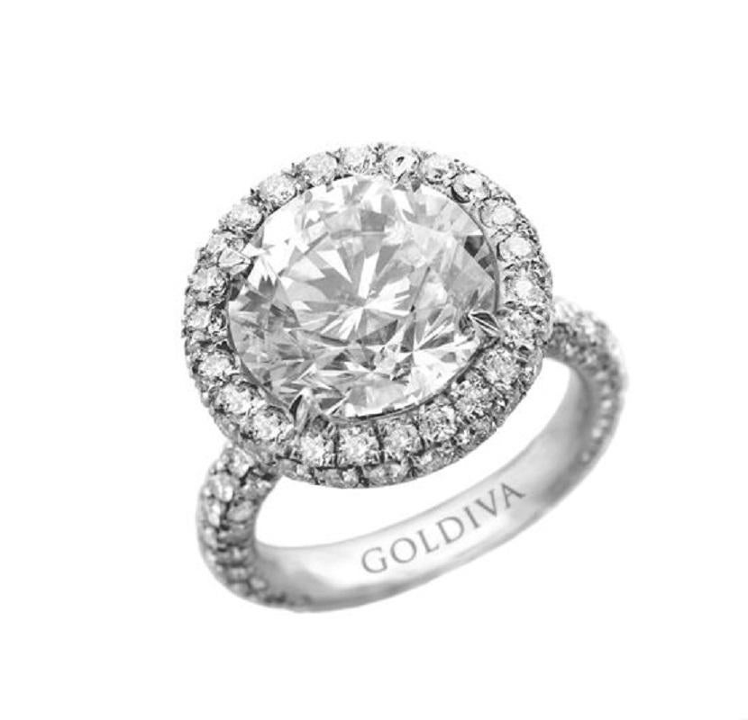 Diamond ring with GIA 4.54 h-vs2 (rdc3681) set with micropave diamonds (1.20ct)in a halo all the way around in platinum setting. 
