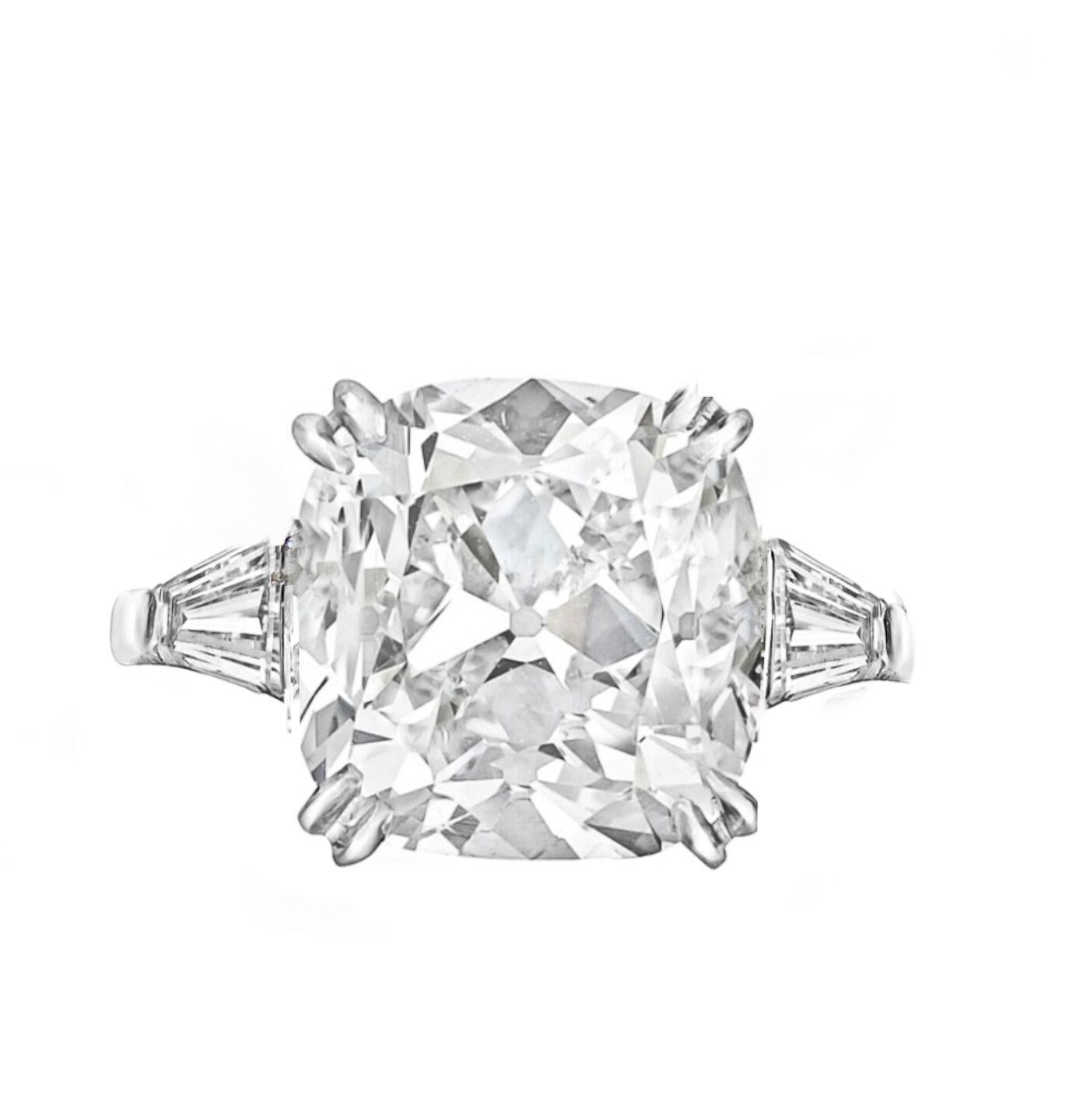 Diamond ring with (radc816) gia 5.52 rad fsi2 center diamond set in a platinum setting with two tapered baguettes (.75ct) on each side. 

