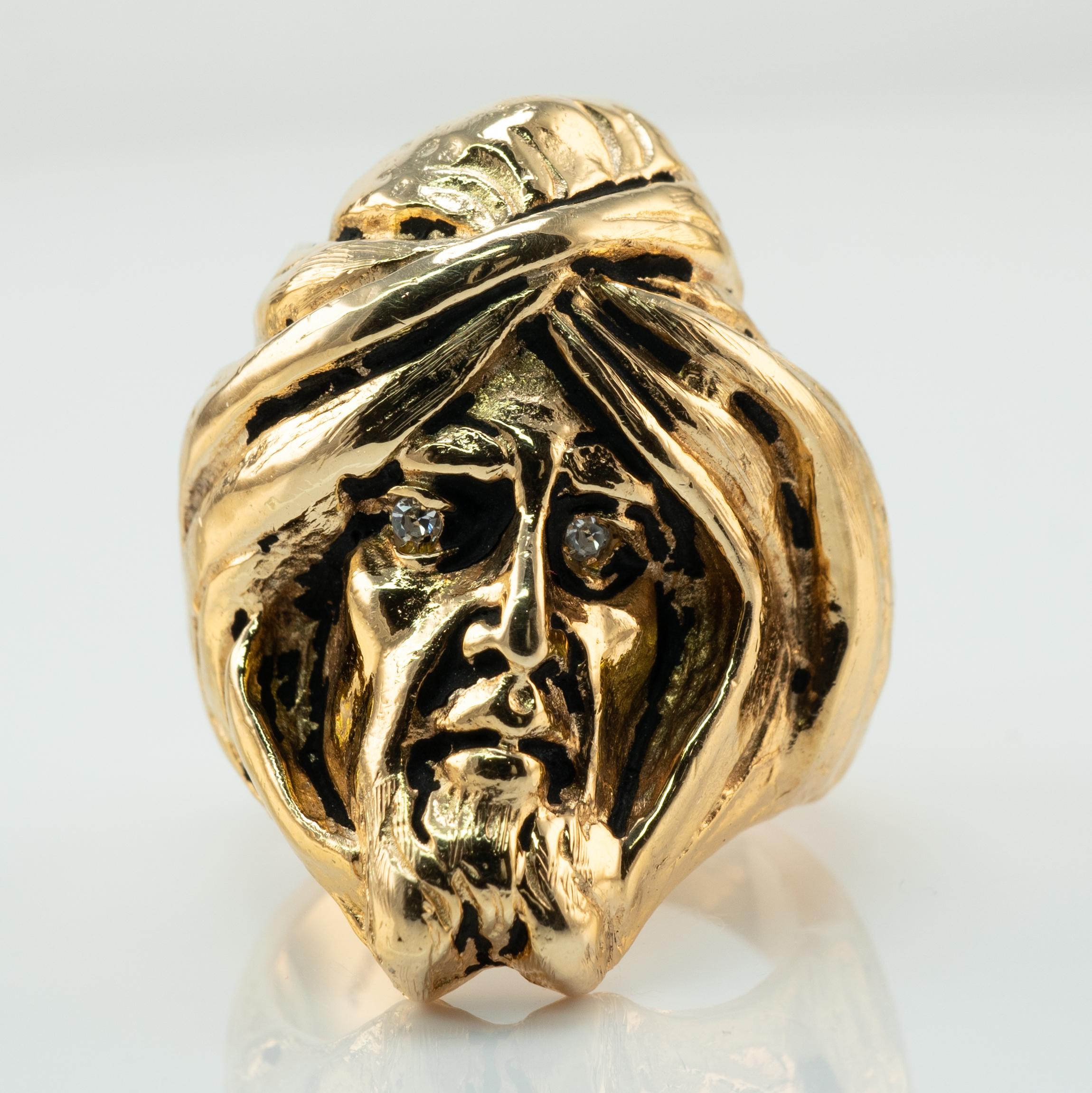 Diamond Ring Man Turban Head Face 14K Gold Vintage

This unique and one of a kind vintage ring is finely crafted in solid 14K Yellow gold and made in the shape of a man's face with a turban. The details of this piece are amazing, it is like a