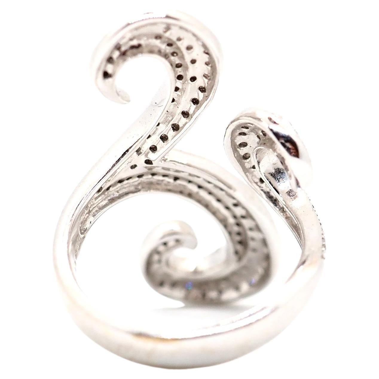 A stunning diamond ring made of 18K white gold. A beautiful spiral design of this curved ring makes it special. This ring is perfect for any special occasion. All paved with diamonds, approximate weight of the stones is 1.4 carat.

Total weight: 10