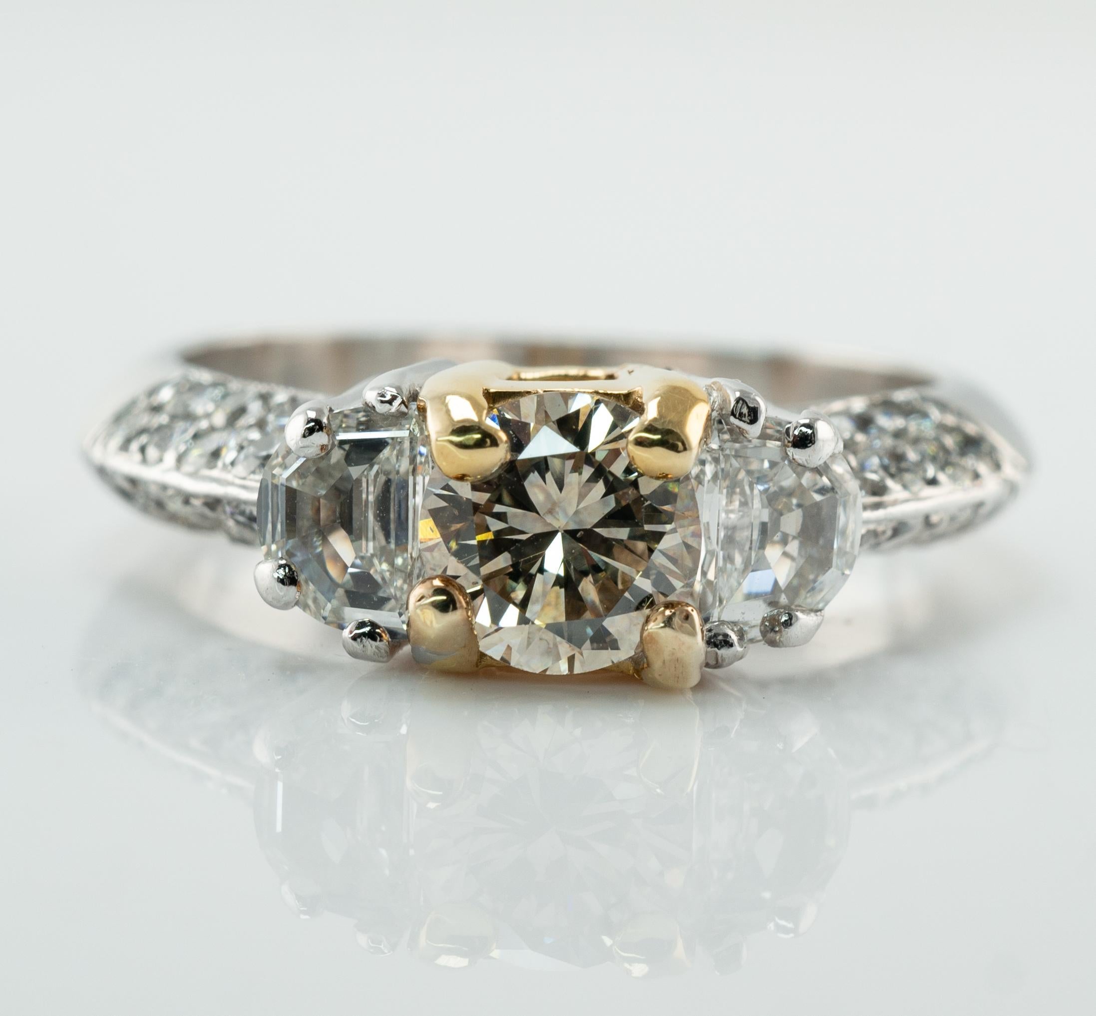 Diamond Ring Platinum Band 1.68 TDW by Hearts on Fire

This beautiful estate ring is finely crafted in solid luxurious Platinum and set with amazing natural diamonds. The center round brilliant cut diamond is set in 18K Yellow Gold mounting and it