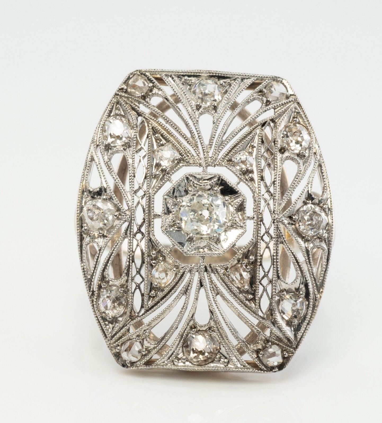 This antique ring circa the 1910s is finely crafted in solid 14K gold for the shank and Platinum for the top (carefully tested and guaranteed). Seventeen old miner cut diamonds are set with gorgeous milgrained mounting. The center diamond is .10