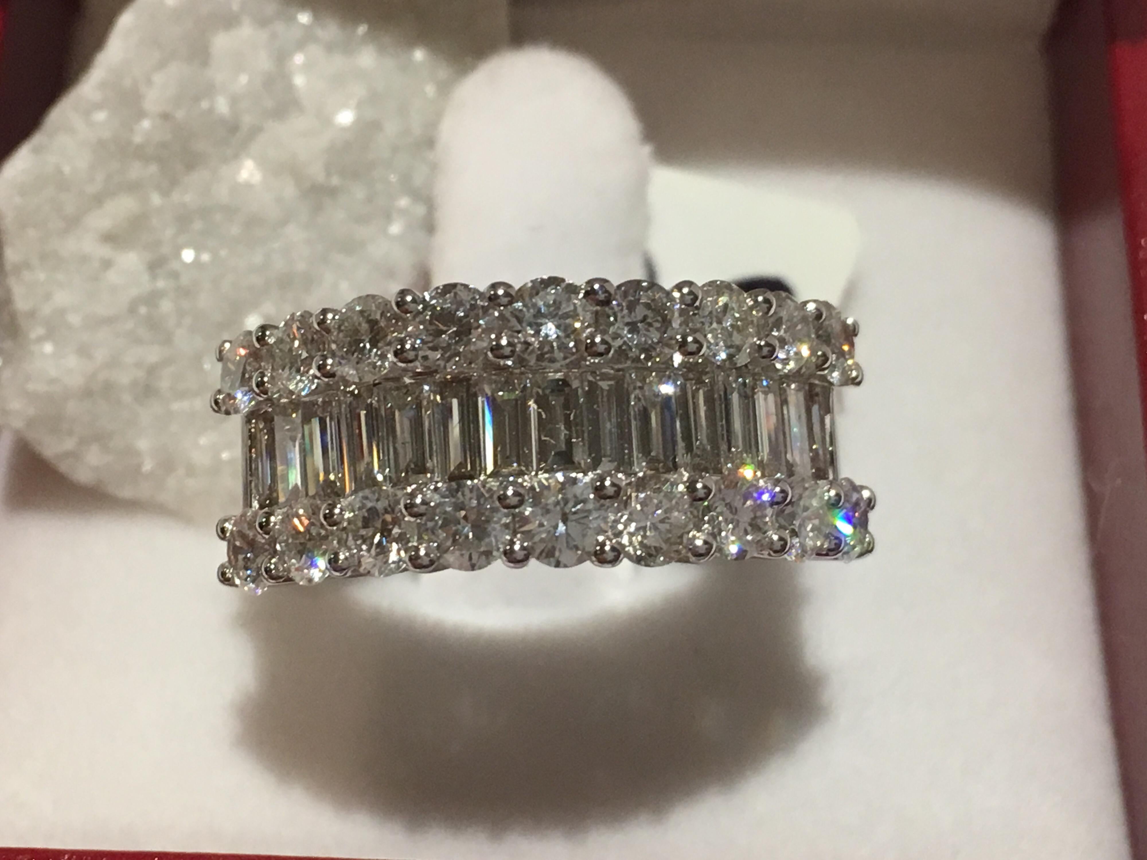 White Diamonds Baguette and Round  set in 18K white Gold, 8.20 Gram total weight.
Total Diamonds 2.10 Carat. 
Baguette size is 8.5 MM.
All Diamonds are matched  and VS quality with D/E color.
The Ring is 6.5 but can be resized.