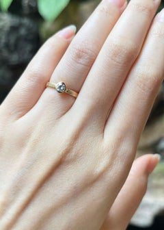 Diamond Ring set in 18K Gold Settings