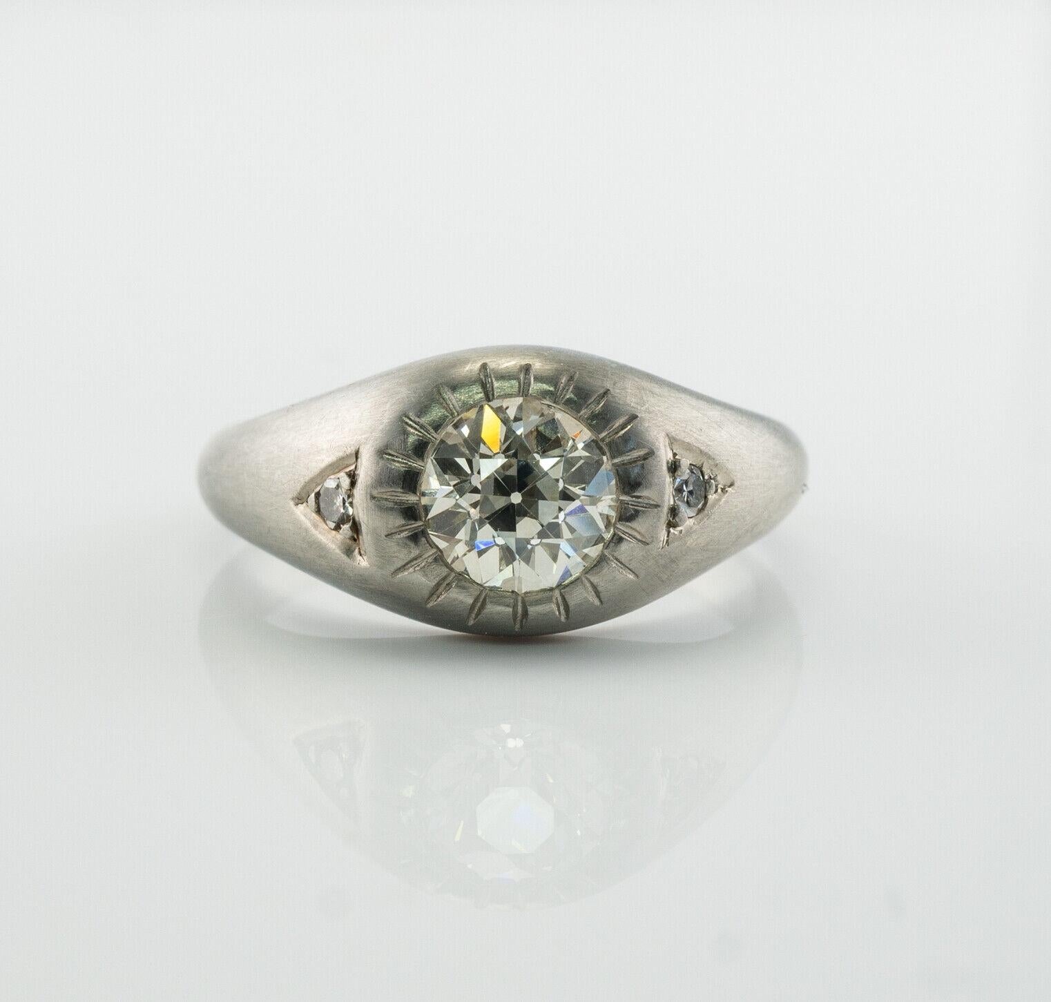 This stunning vintage circa 1940s ring is finely crafted in solid 18K White gold and set with natural Old mine cut diamond in the center and two single cut diamonds on the sides. The center gem is 1.00 carat of VS1 clarity and IJ color. Two sides