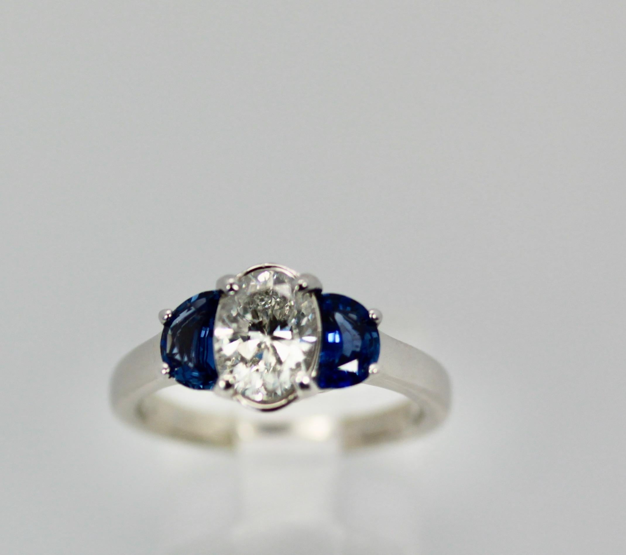 Oval Cut Diamond Ring with Half Moon Sapphire Sides 2.20 Carats For Sale