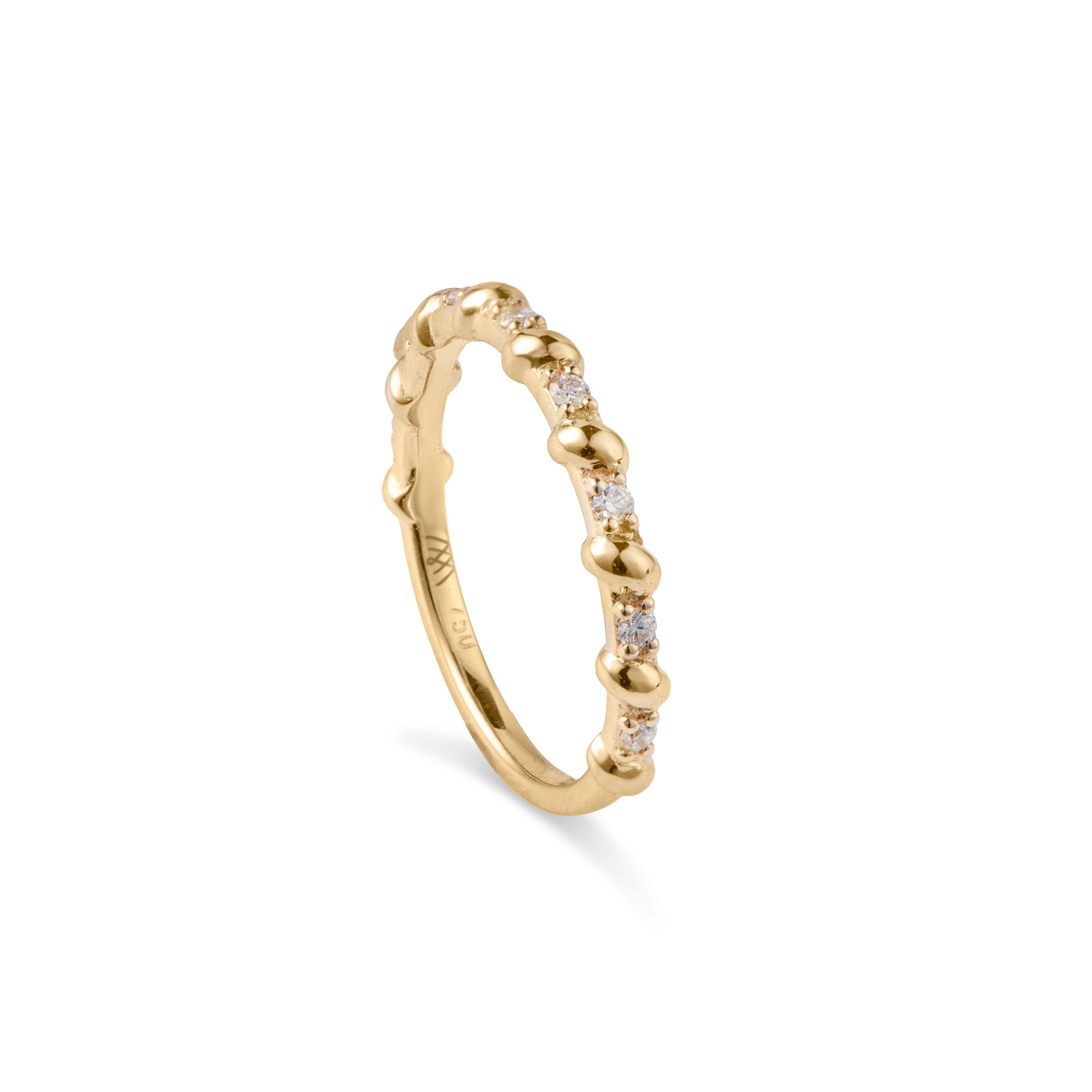 This beautiful diamond ring, by Michelle Massoura, is crafted in 18 Karat Yellow Gold and has a rope-like gold detail. It is set with natural round diamonds along half the band. 

The ring will be shipped complimentary with DHL Express shipping all