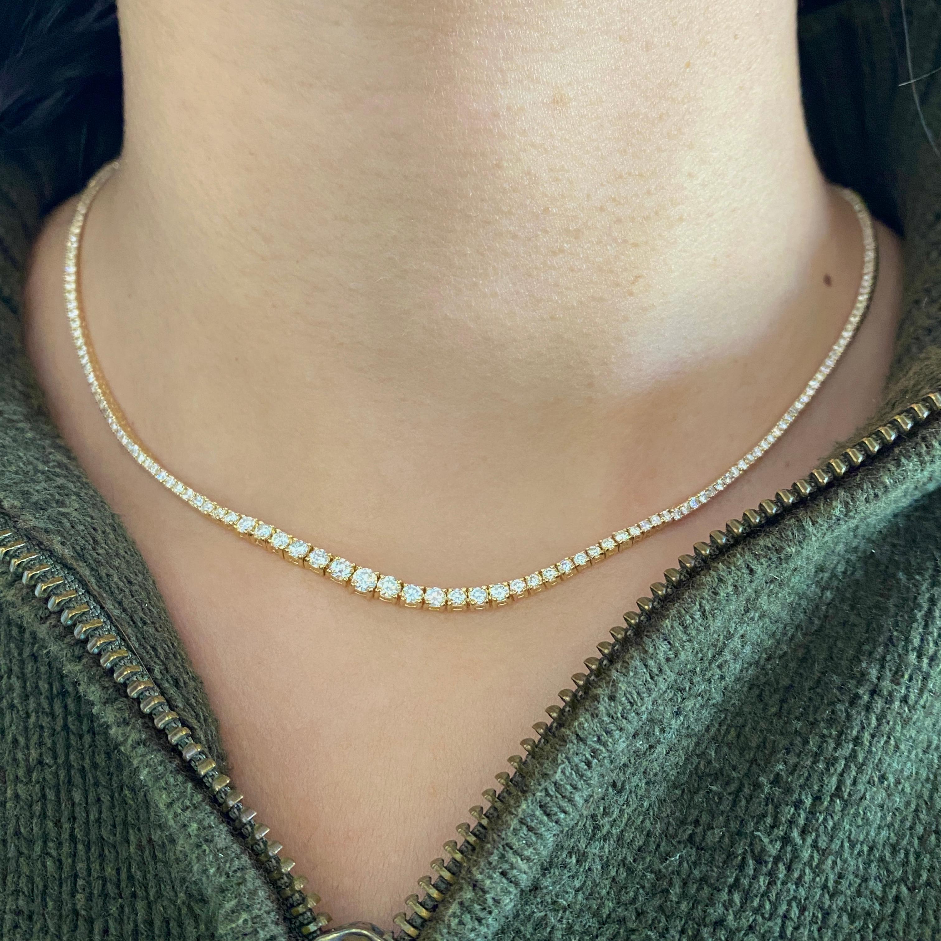 This beautiful Riviera graduated diamond tennis necklace adds grace and flair to your look any day! The diamonds weigh a total of 4 carats and have SI clarity with G-H color. Each diamond is set with four prongs and sparkle brilliantly! The diamonds
