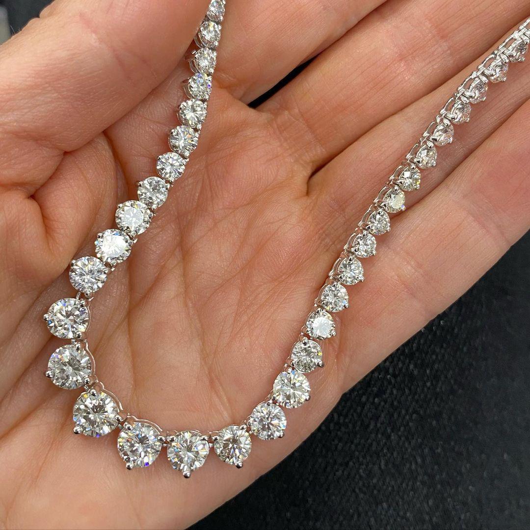 This stunning and impressive Riviera Necklace features substantial Diamond weight of 18 Carats in beautifully graduated Round Brilliant Cut gems with a sparkly excellent cut white color G clarity VS/SI1. Each stone has a three claw setting with open