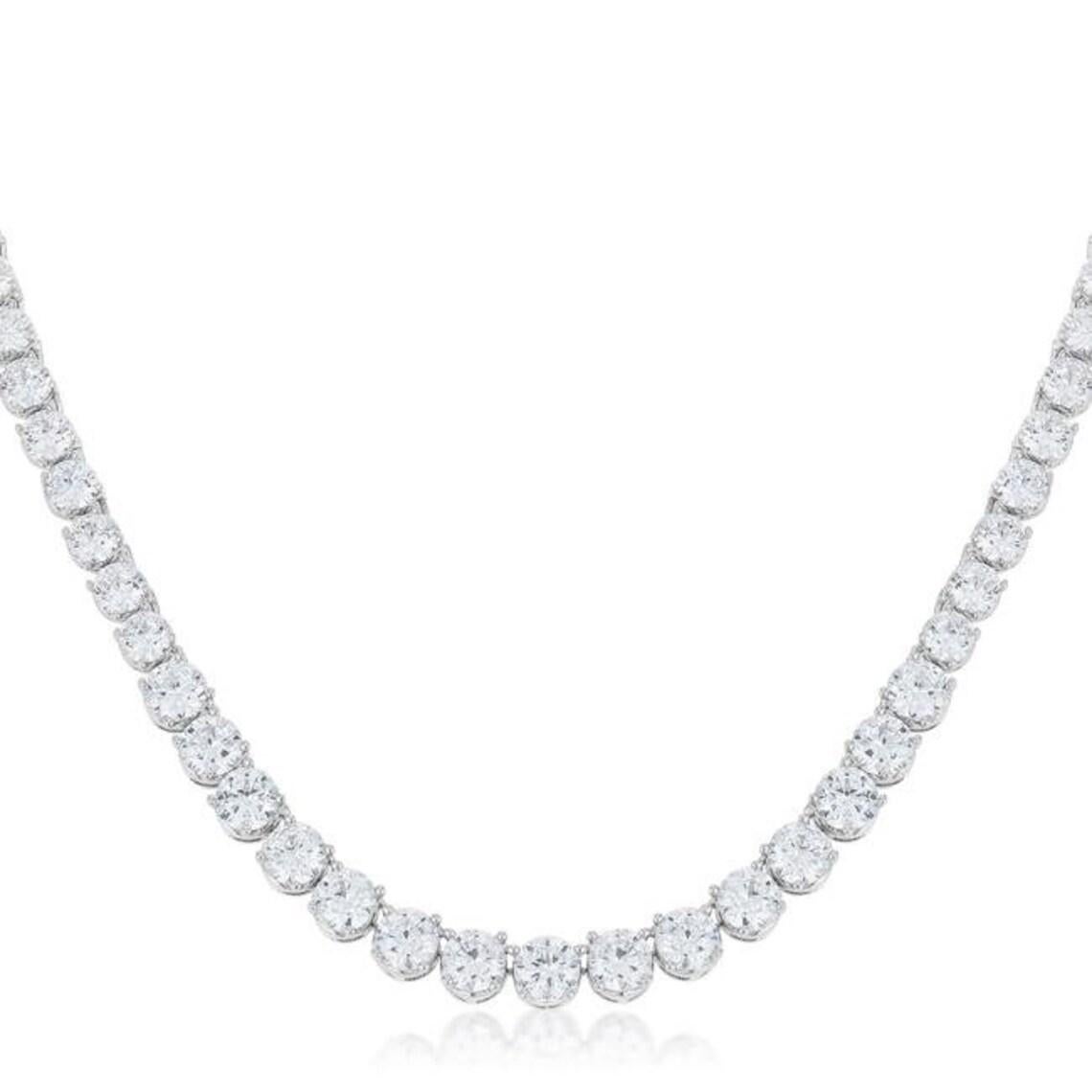 This stunning and impressive Riviera Necklace features substantial Diamond weight of 18 Carats in beautifully Round Brilliant Cut gems with a sparkly excellent cut

18k white gold graduated diamond riviera necklace. Mounted in the necklace are 111