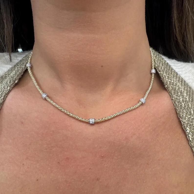 14 Karat yellow gold beaded woven chain featuring 5 stations of 90 diamond rhondels weighing 1.07 carats.

More Chain Necklaces in stock
Message for pictures and details.