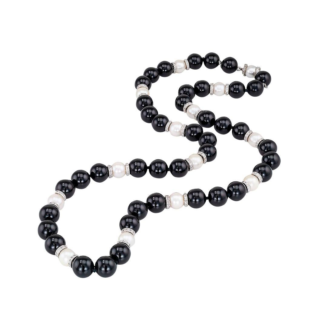 Vintage diamond rondelle cultured pearl black onyx and white gold bead necklace circa 1950.  Love it because it caught your eye and we are here to connect you with beautiful and affordable jewelry.  Decorate Yourself!  Simple and concise information