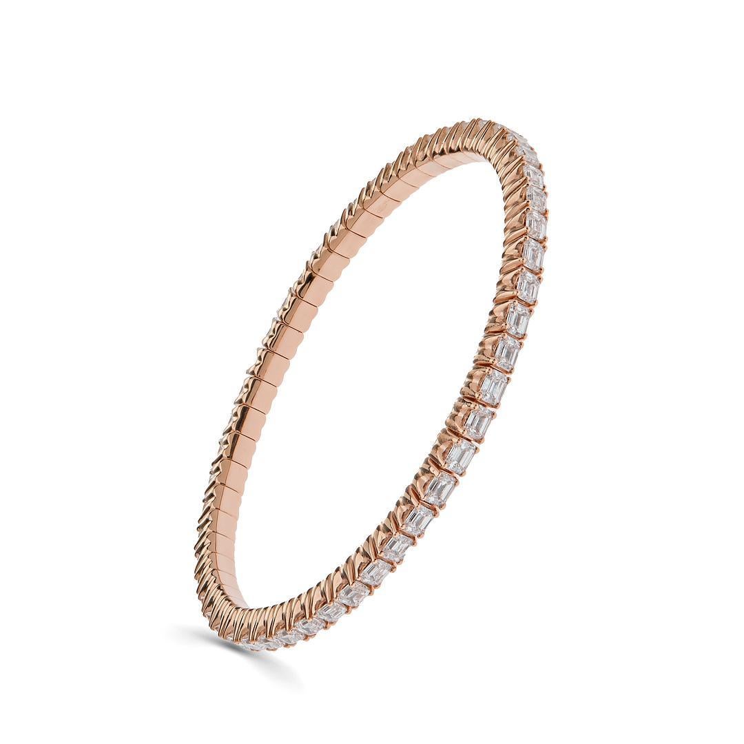 Indulge in the timeless allure of the Diamond Rose Gold Bangle, a mesmerizing blend of sophistication and elegance.

Crafted from the finest 18-karat rose gold, this exquisite bangle exudes a radiant warmth that complements its luxurious design. The