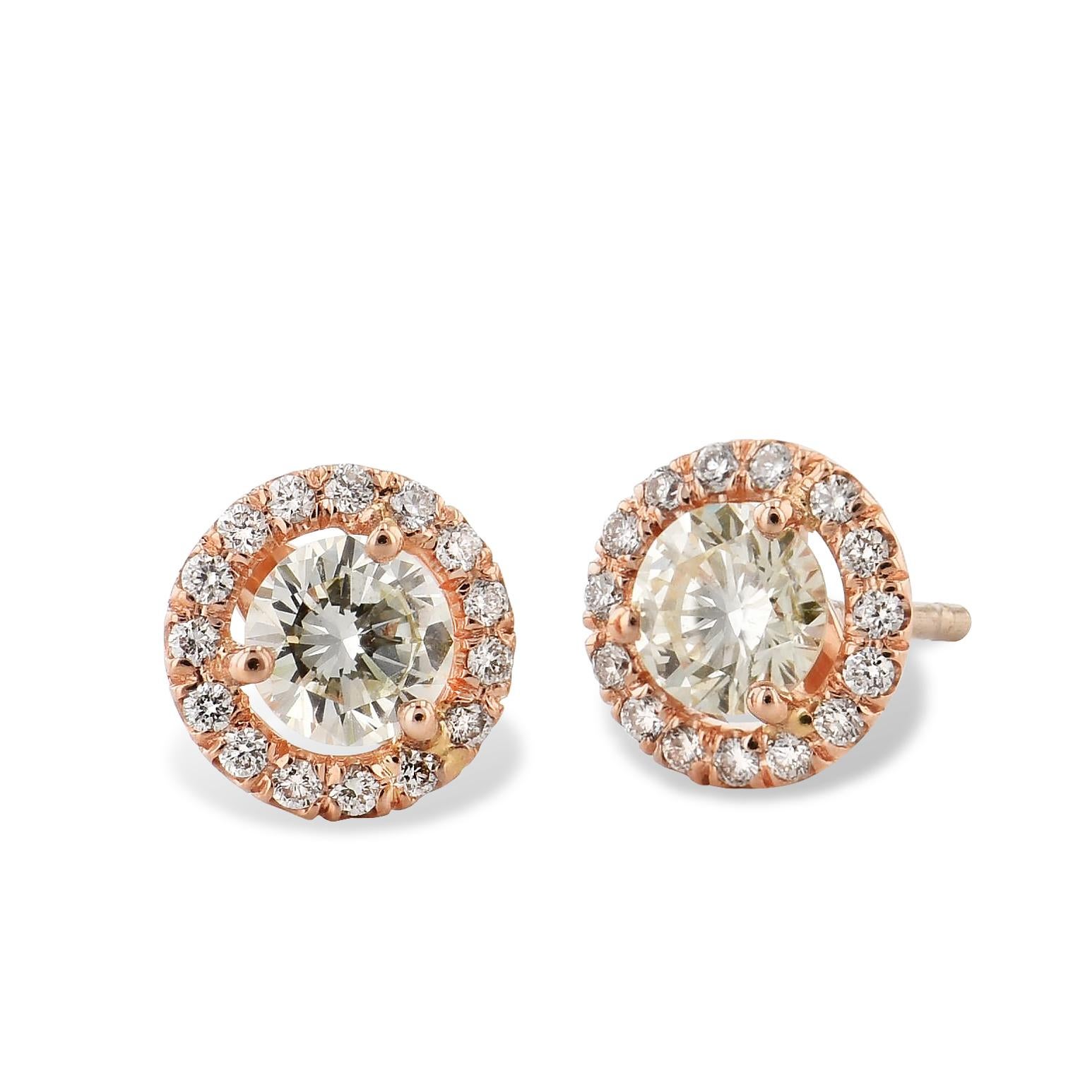 Feel rosy with these 18 karat rose gold earrings, hand-crafted with halos of pave-set diamonds(0.21 carats in total weight) surrounding light yellow diamonds with a total weight of 0.86 carats.