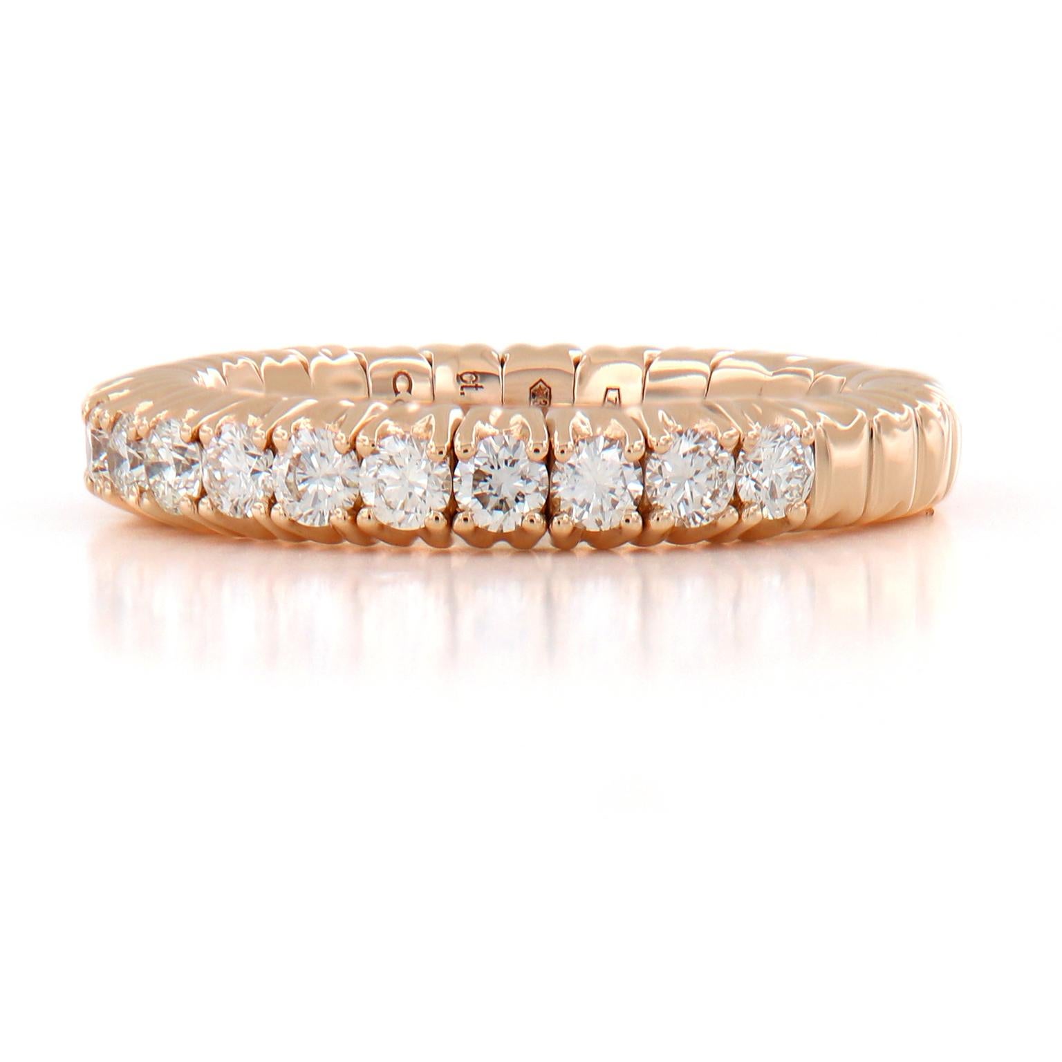 This beautiful stretchable diamond band ring is designed for comfort and perfectly fits one’s finger. It even fits those with larger knuckles! The ring is crafted in 18k rose gold and feature 15 round brilliant cut diamonds. The band can stretch up