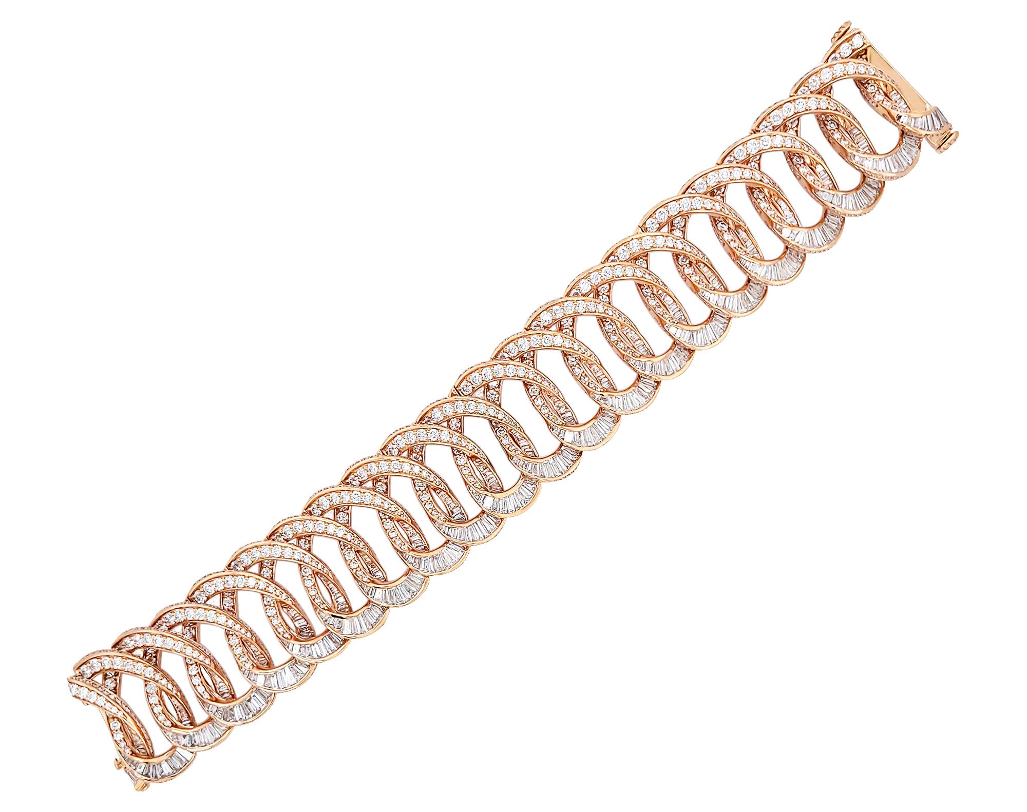 A stunning bracelet designed as links, decorated with diamonds and mounted in 18K rose gold.

Diamonds breakdown:
178 baguette diamonds weighing 3.08 carats
1,562 round diamonds weighing 17.97 carats
277 tapered baguette diamonds weighing 10.28