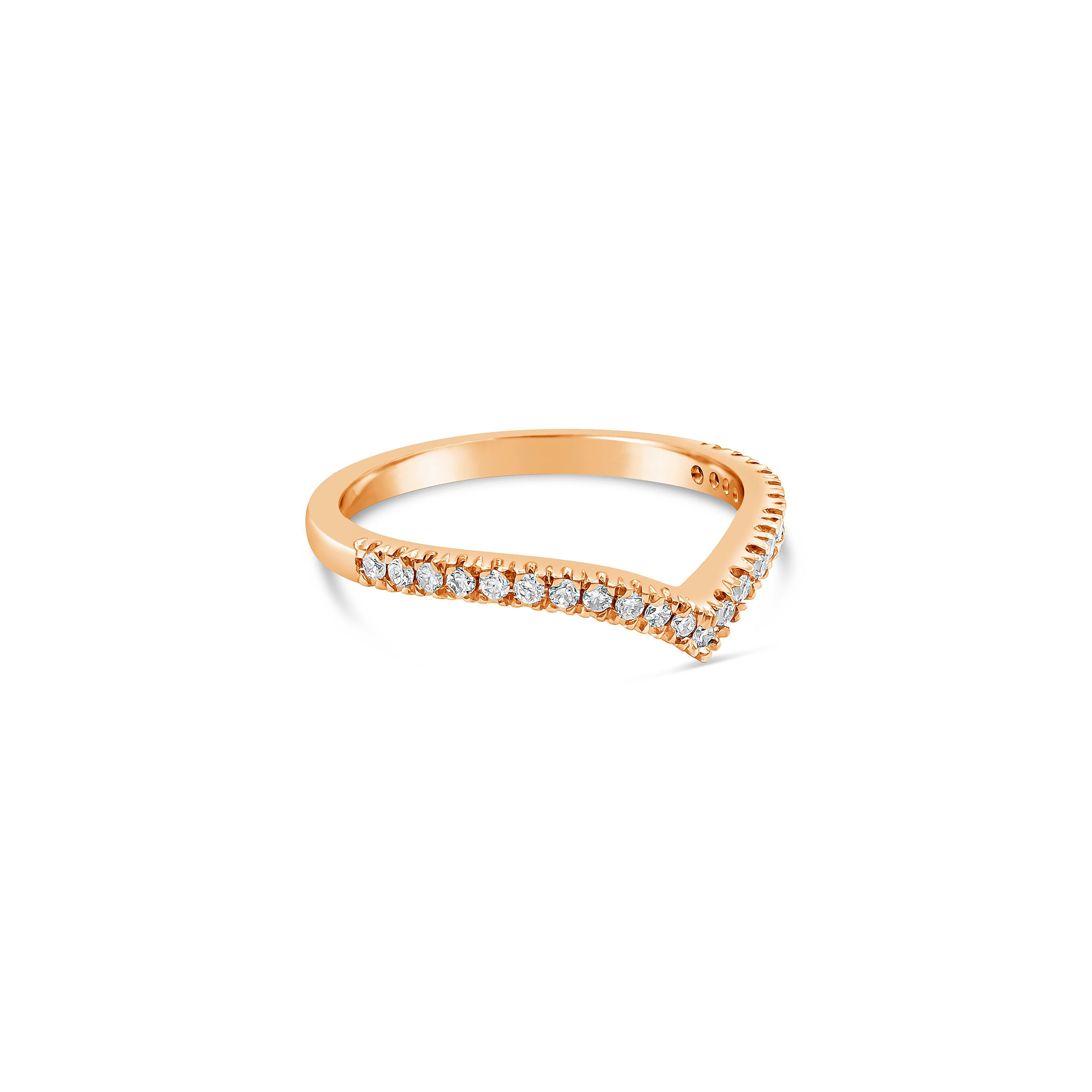 A modern wedding band style that can stack with an engagement ring. Set with 0.22 carats total of round brilliant diamonds along a V-shaped mounting. Made with 18K Rose Gold. Size 6.75 US resizable upon request.

Roman Malakov is a custom house,