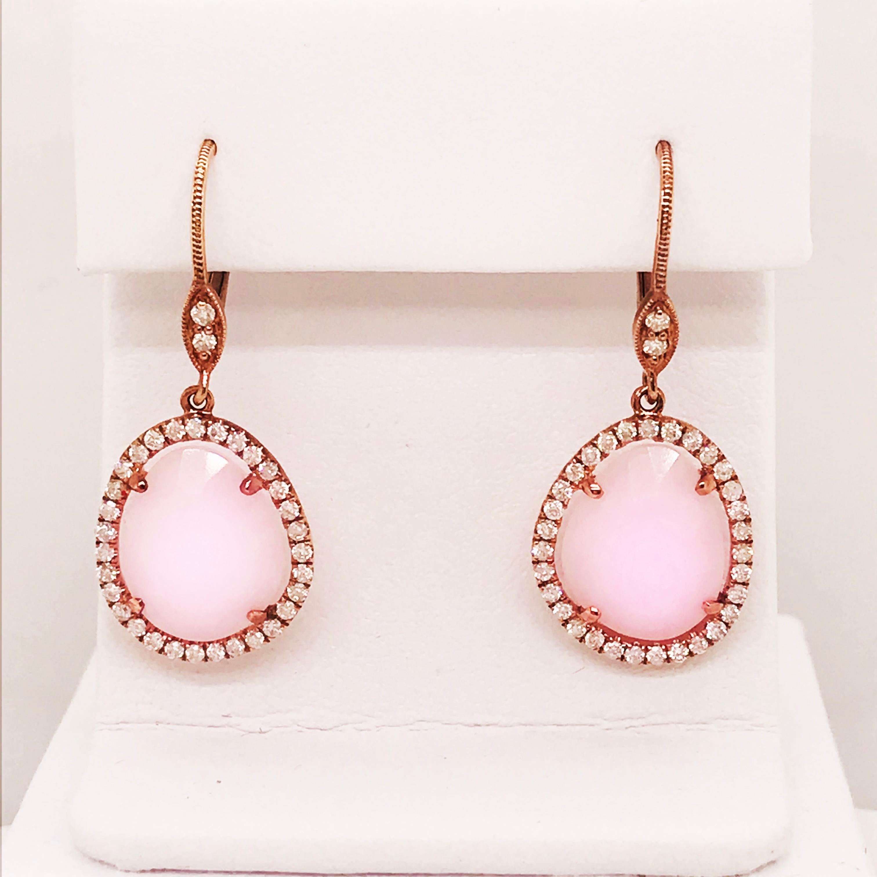 Rose Gold and Pink Opal & Diamond Earring Dangles! These 14 karat rose gold organic genuine pink opal pieces have a beautiful cut that allows light to reflect from every angle of the surface. The pale pink is a subtle touch of rose and set in rose