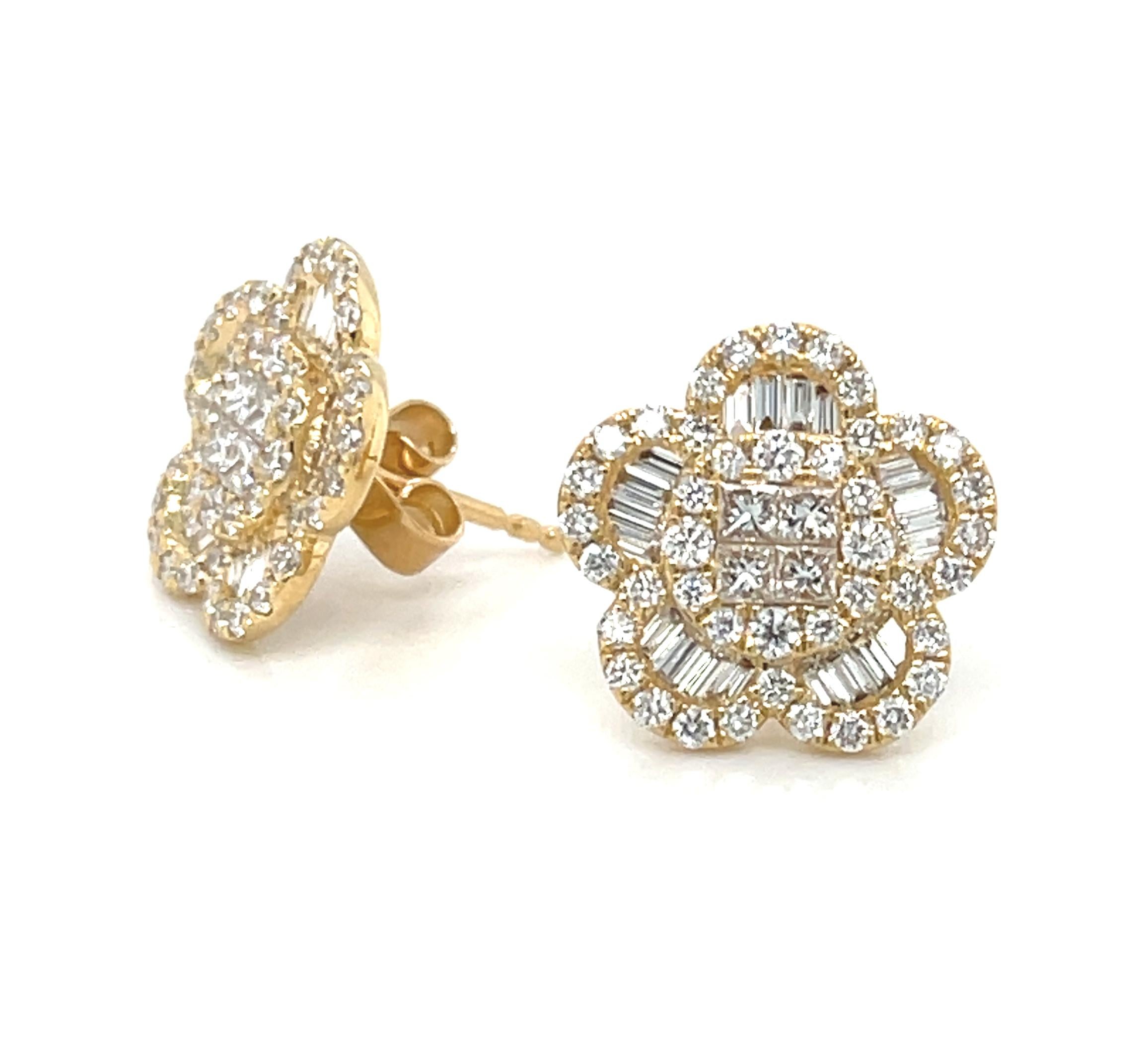 These gorgeous diamond and 18k yellow gold floral earrings feature 1.35 carats of sparkling diamonds in 3 different shapes. Baguette-cut diamonds create elegant petals that encircle round brilliant and princess-cut centers, with the entire flower
