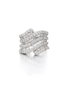 Diamond Round And Baguette Ring in 18K White Gold.