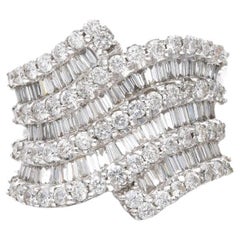 Diamond Round And Baguette Ring in 18K White Gold.