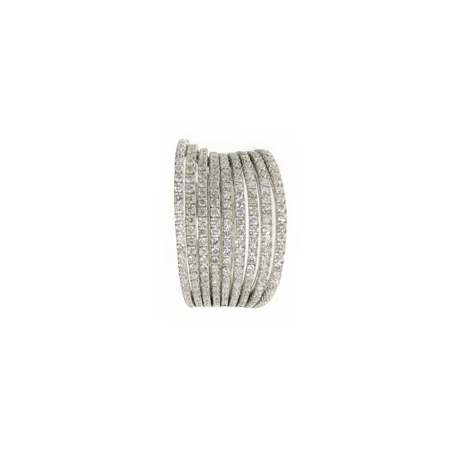 A modern twist on a timeless and classic piece of jewelry, Ri Noor's Diamond Rows Cocktail Ring shimmers in the light creating a dazzling presence on the wearer's finger. The ring features stacked bands of different sizes arranged together to create