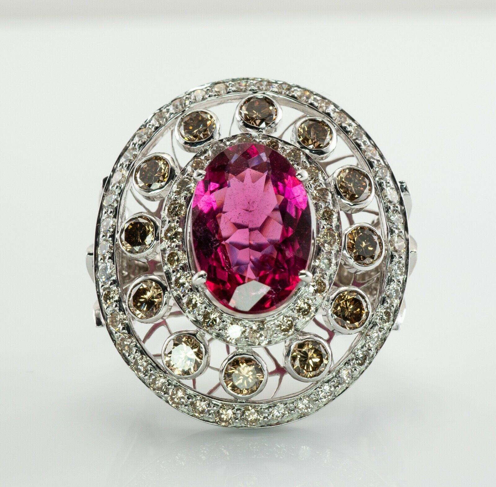 This vintage ring is finely crafted in solid 18K White gold. The center genuine Earth mined Pink Tourmaline Rubellite measures 13mm x 10mm and estimated to be 5.51 carats. This is a very good quality gem of great intensity and strong brilliance. The