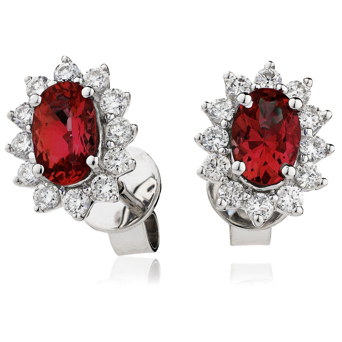 Graceful and striking 1.66 Carat total ruby and diamond Cluster earrings, The brilliant oval ruby in the middle of each earring is tastefully encircled by 12 white stunning diamonds, 24 precious diamonds for both, weighing a total of 0.40 carat