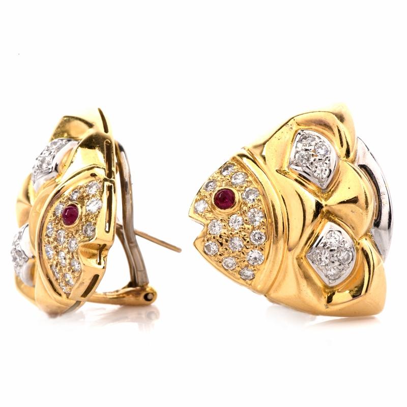 These estate earrings of impressive aesthetic are crafted in a combination of 18K yellow and white gold, weigh approx. 21.6 grams and measure approx. 25 mm long and 25 mm wide. Designed to simulate the head and part of thorax of a pair of fish, the