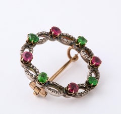 Diamond, Ruby, and Demantoid Garnet Brooch