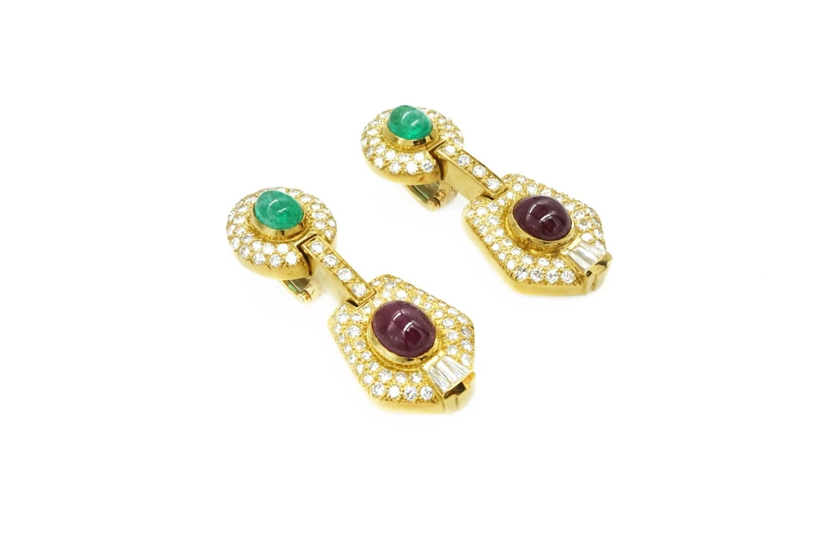 Diamond, Ruby, and Emerald Earrings in 18k. Made in USA, circa 1970.
Along with two Cabochon Rubies weighing app 5.00 ct and two Cabochon Emeralds weighing app 5.00 cts, set with 164 and app. 5.00 ct of Diamonds

G-H Color VS1-SI1 Clarity
Gold
